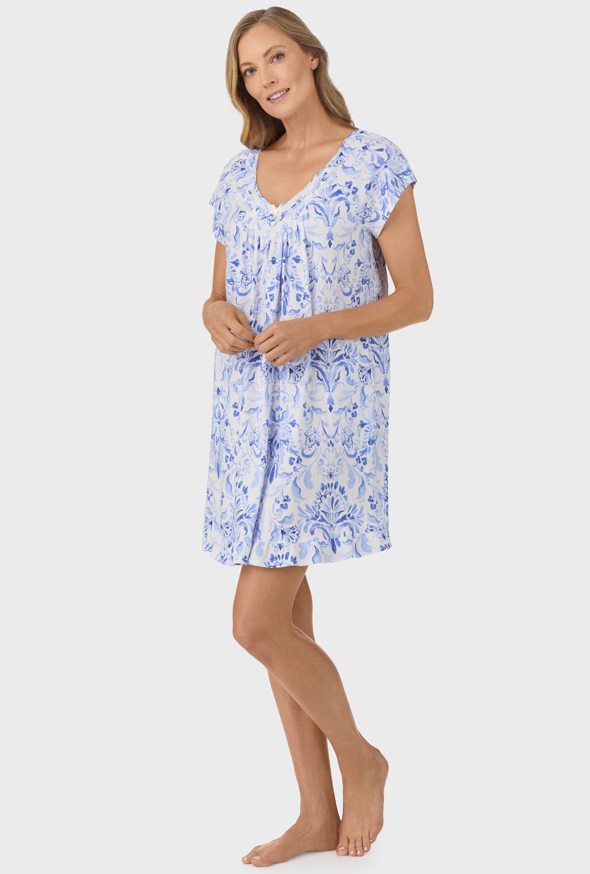 A lady wearing blue damask cap sleeve nightgown