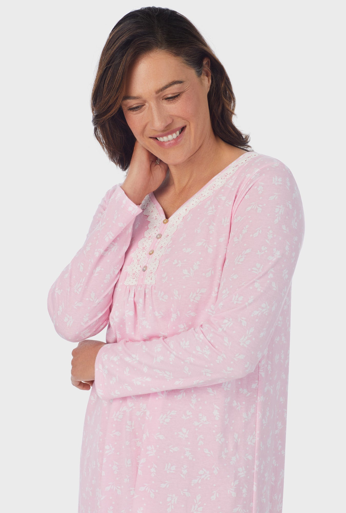 A lady wearing pink Long Sleeve Nightgown with White Rosebuds  print