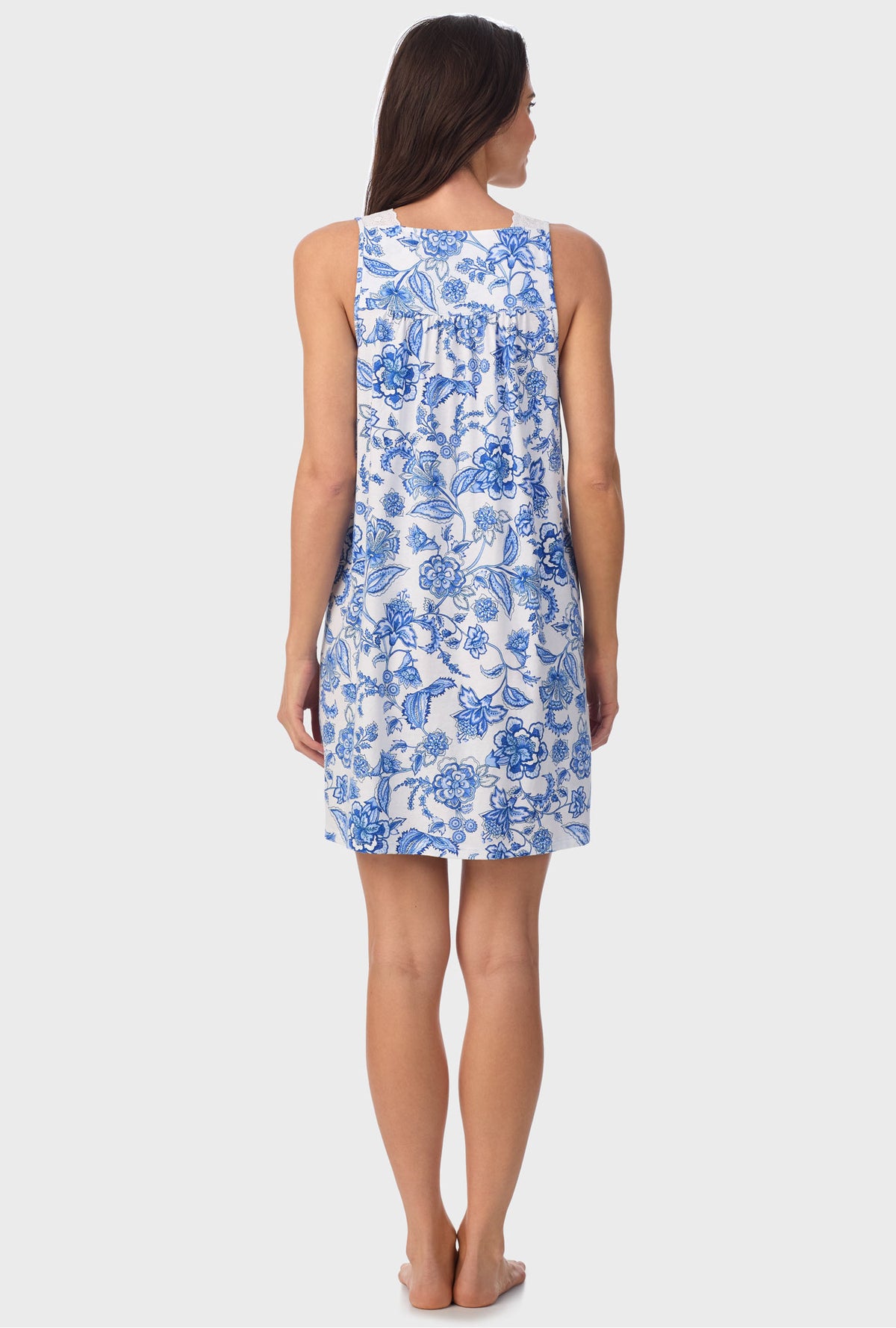 A lady wearing blue sleeveless   Floral Vine Sleeveless Chemise with Colbalt Blue print