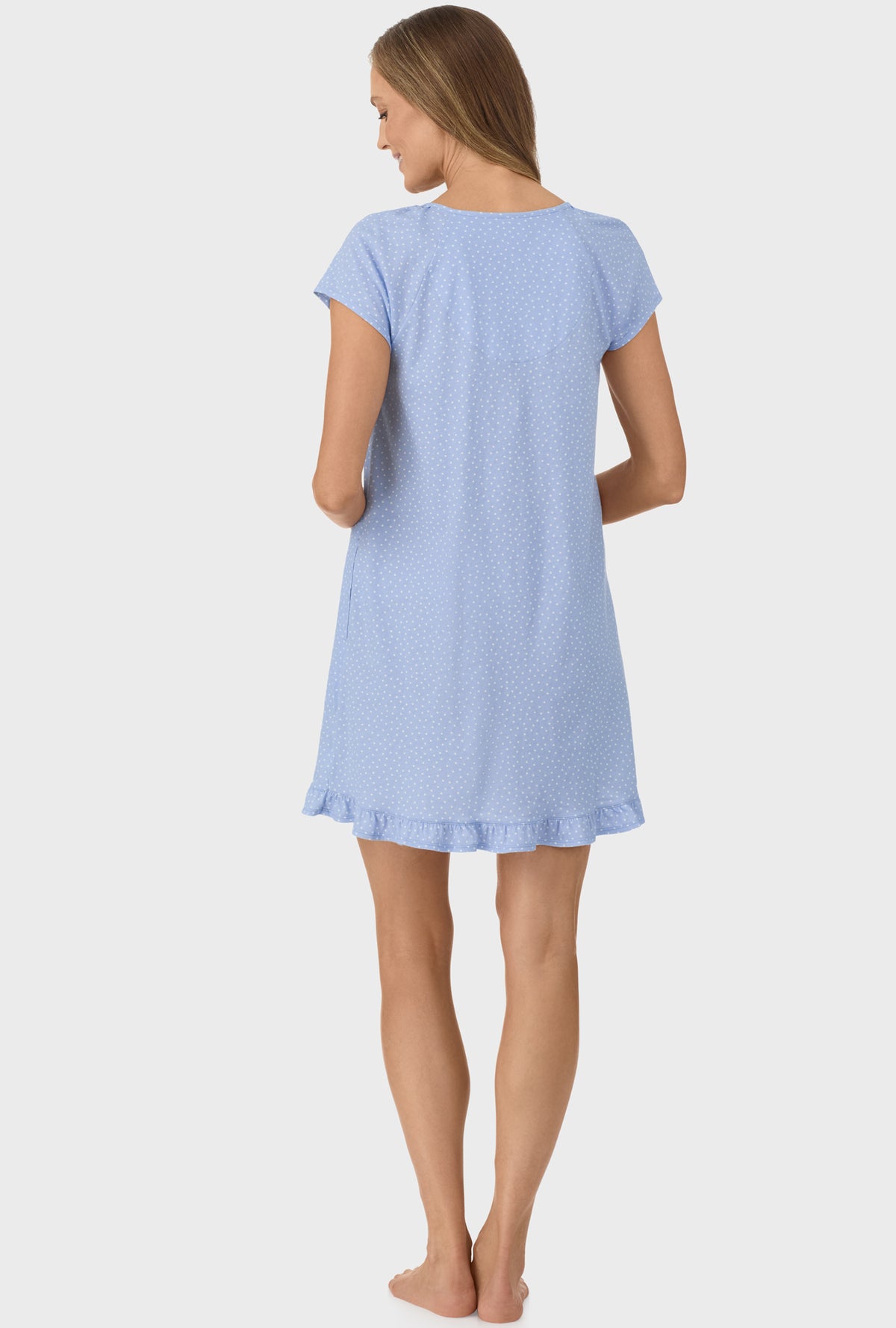 A lady wearing Sky Blue Dot Cap Sleeve Nightgown