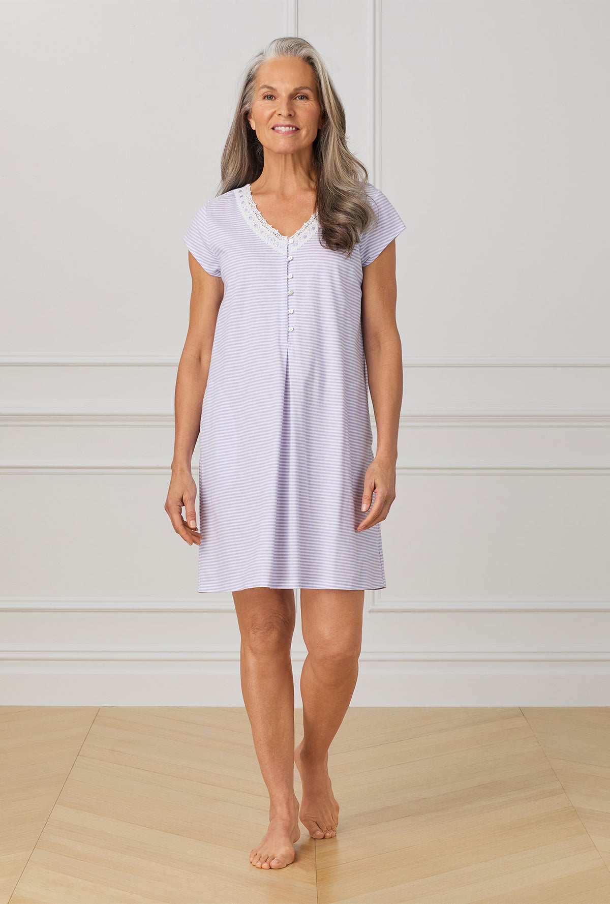 A lady wearing purple cap sleeve nightgown with Lilac Stripe print.