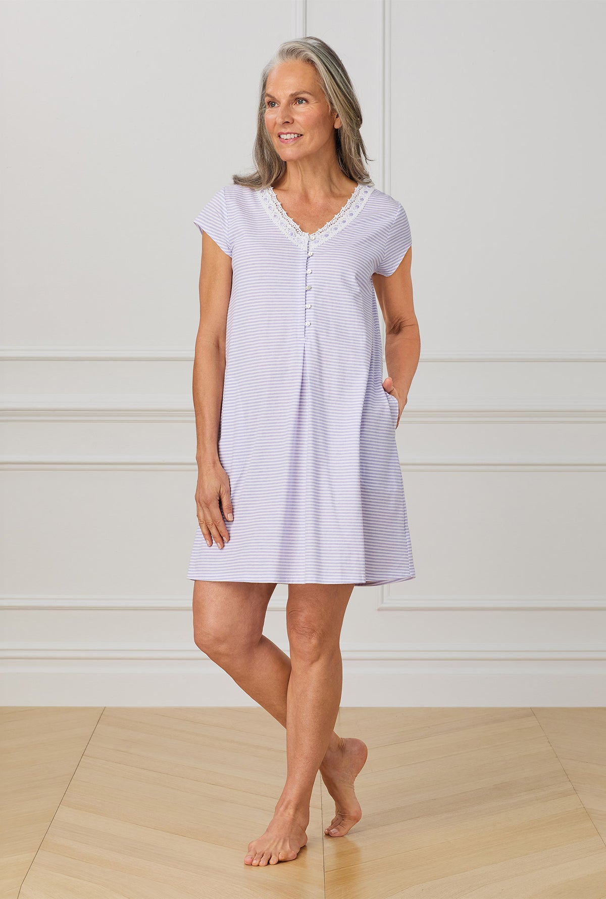 A lady wearing purple cap sleeve nightgown with Lilac Stripe print.