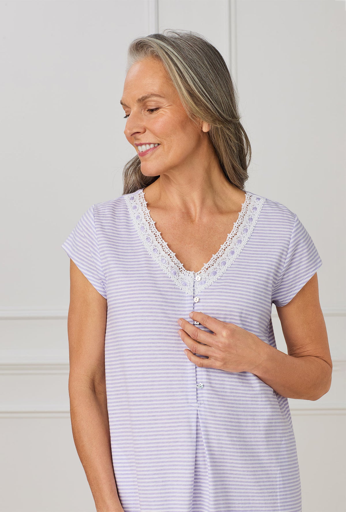 A lady wearing purple cap sleeve nightgown with Lilac Stripe print.