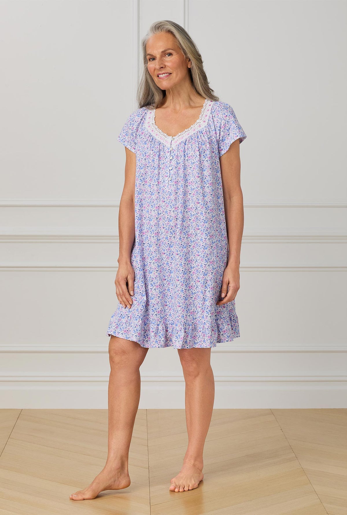 A lady wearing purple short sleeve nightgown with Lavender And Blush Ditsy Floral print.