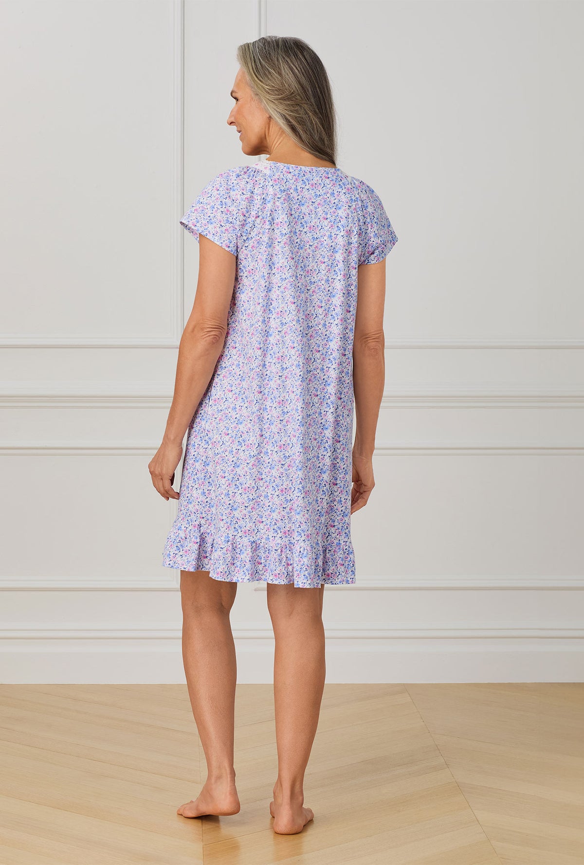 A lady wearing purple short sleeve nightgown with Lavender And Blush Ditsy Floral print.