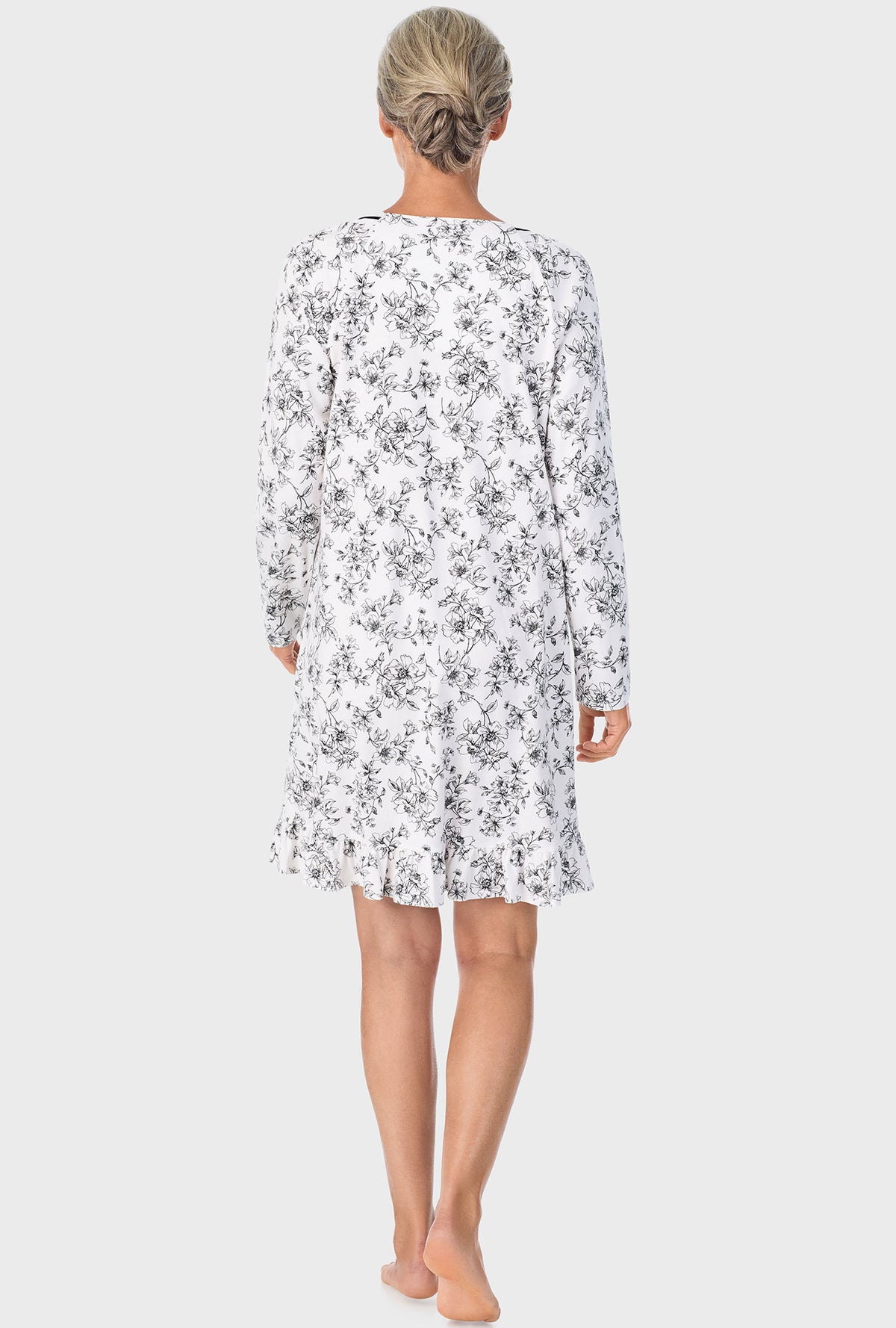 A lady wearing Ivory Floral Long Sleeve Nightshirt