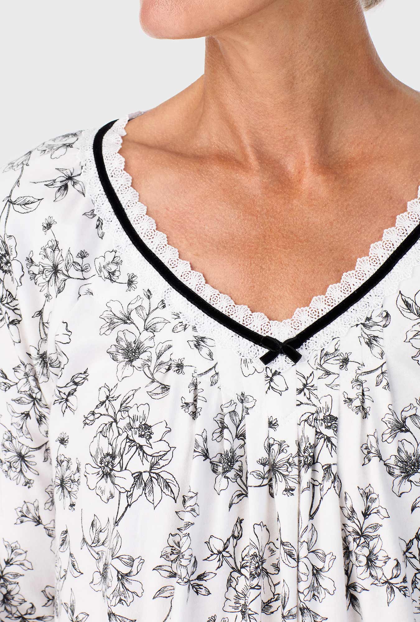 A lady wearing Ivory Floral Long Sleeve Nightshirt