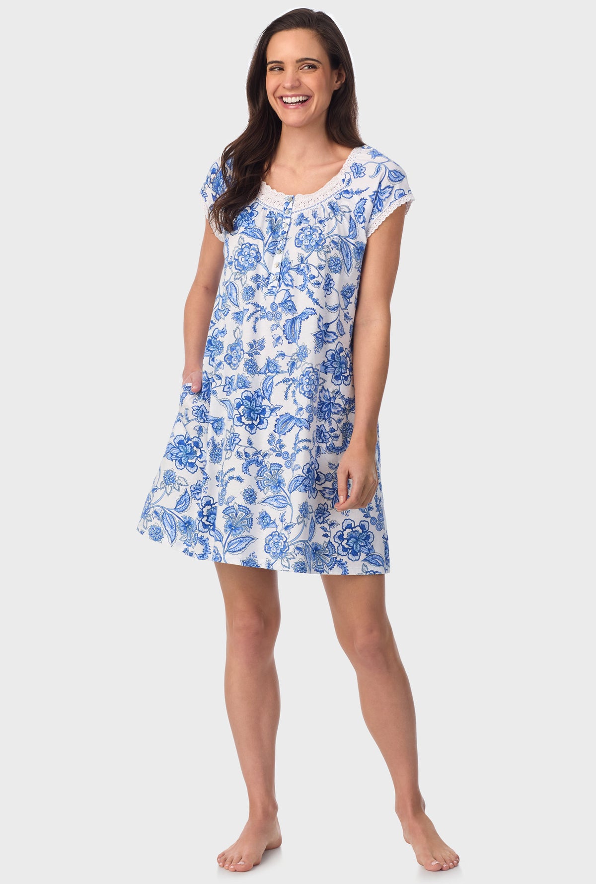 A lady wearing blue short Sleeve  Floral Vine Cap Sleeve Nightshirt with Colbalt Blue print