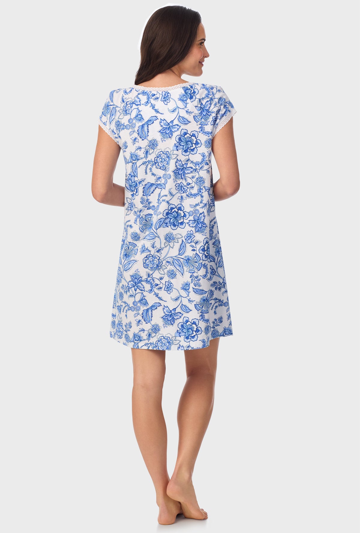 A lady wearing blue short Sleeve  Floral Vine Cap Sleeve Nightshirt with Colbalt Blue print
