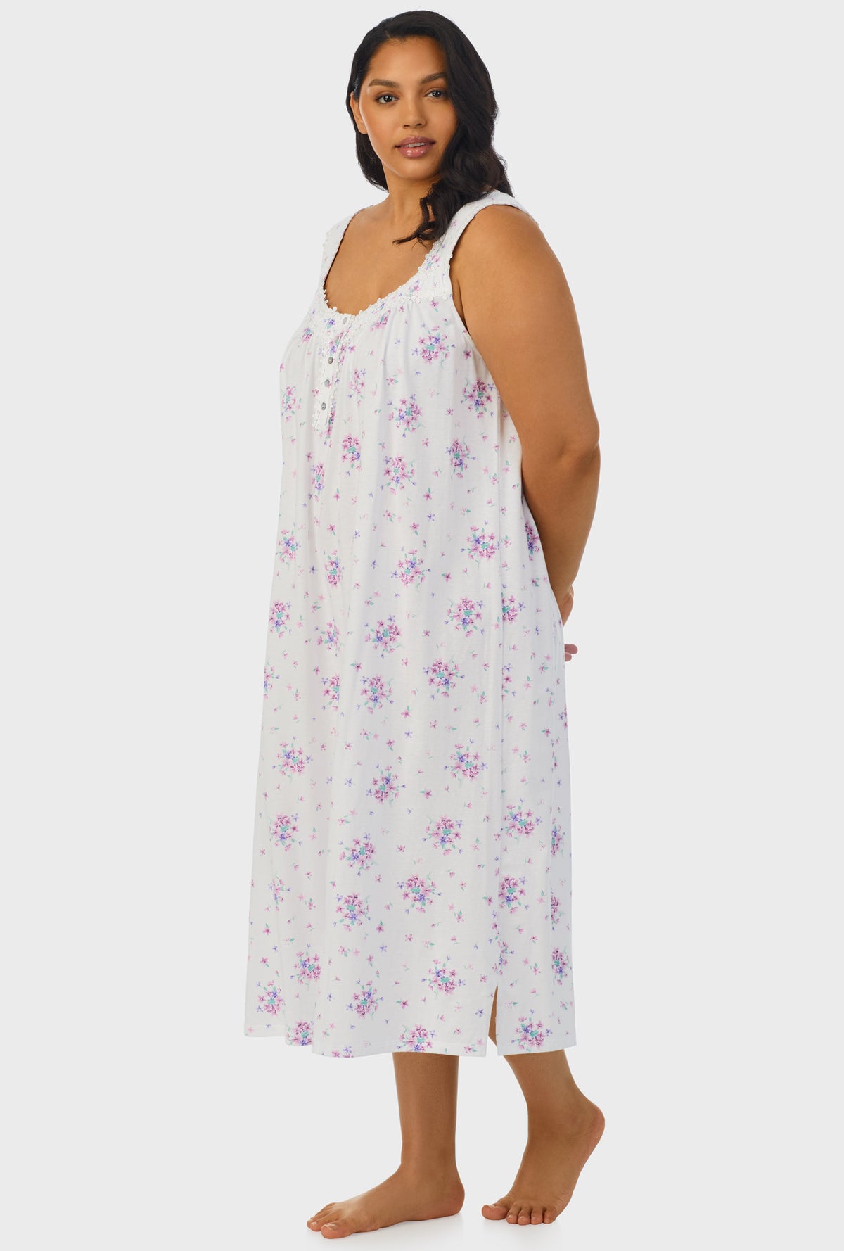 A lady wearing white sleeveless ballet plus size gown with Mulberry Purple Floral Bouquet print.