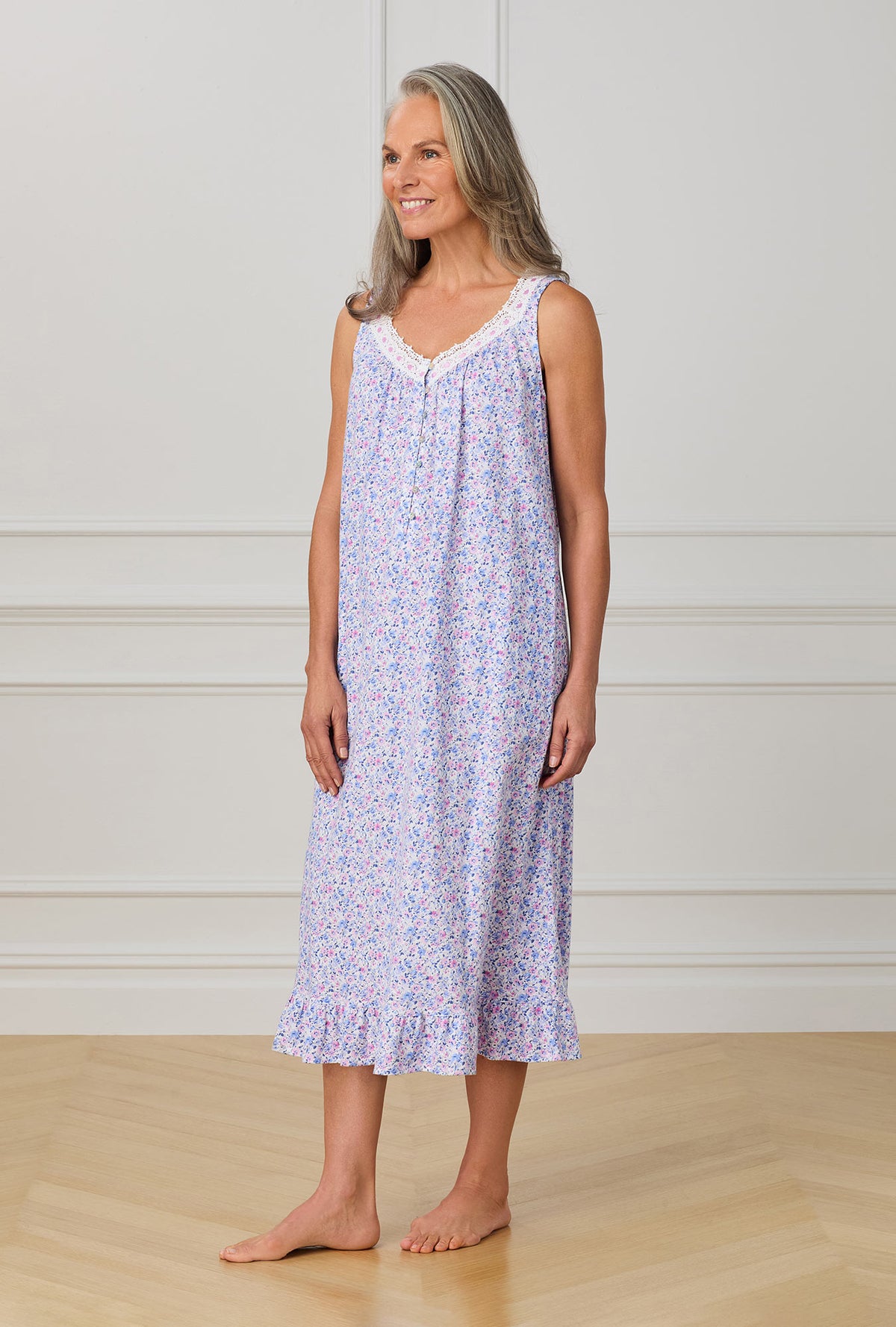 A lady wearing purple sleeveless nightgown with Lavender And Blush Ditsy Floral print.