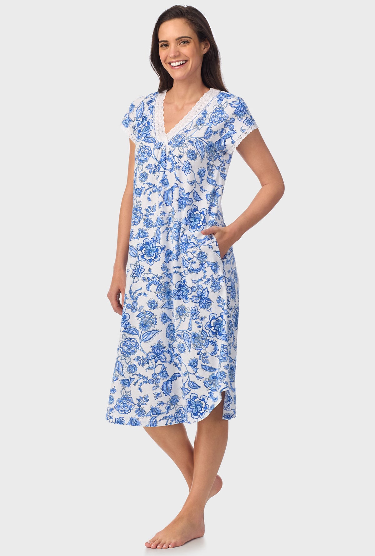 A lady wearing blue short Sleeve Floral Vine Cap Sleeve Nightgown with Colbalt Blue print