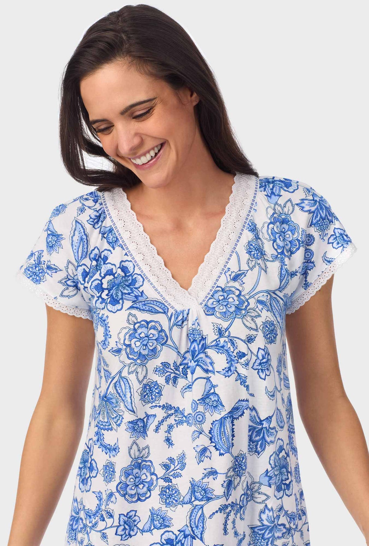 A lady wearing blue short Sleeve Floral Vine Cap Sleeve Nightgown with Colbalt Blue print