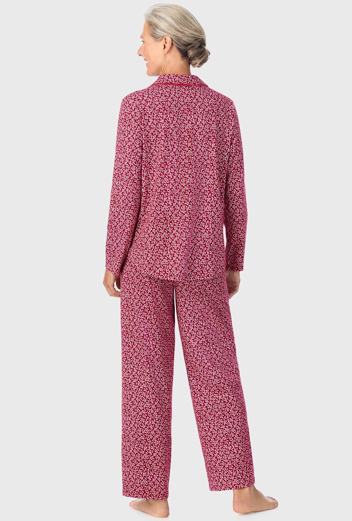 A lady wearing long sleeve pj set with wine vine floral print