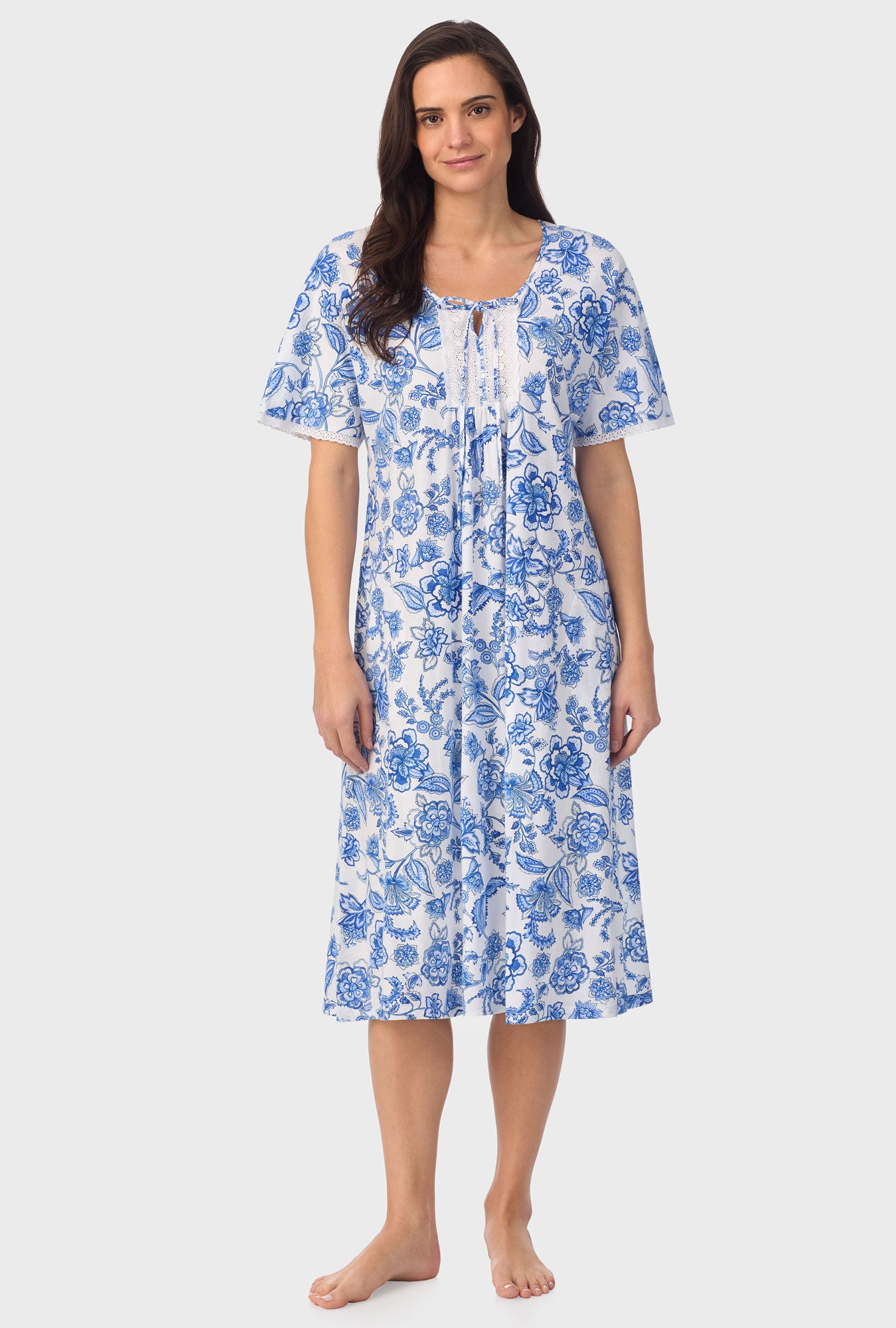 A lady wearing blue short Sleeve Floral Vine Caftan with Colbalt Blue print