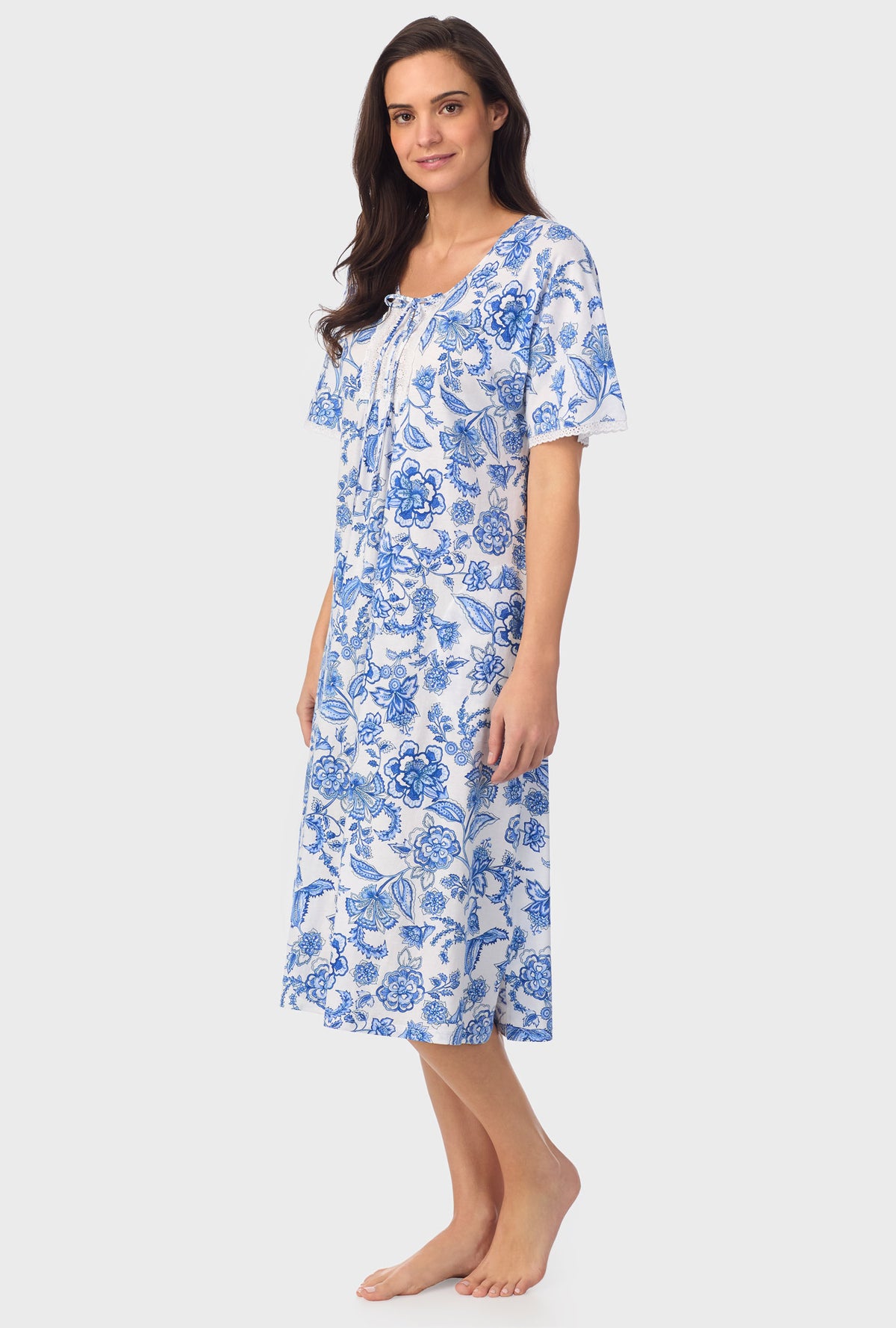 A lady wearing blue short Sleeve Floral Vine Caftan with Colbalt Blue print