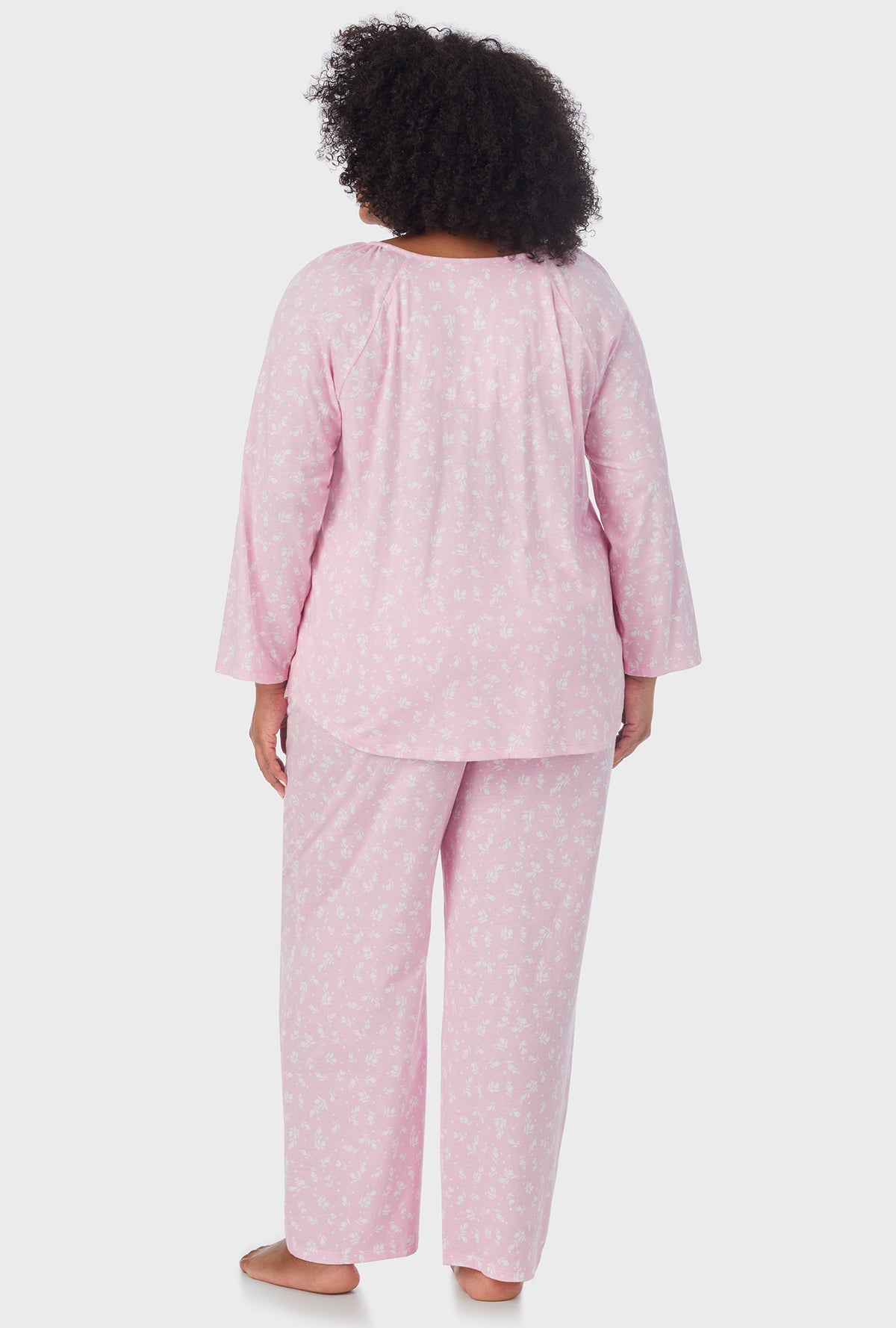 A lady wearing pink 3/4 Sleeve Long Pant plus size PJ Set with White Rosebuds  print