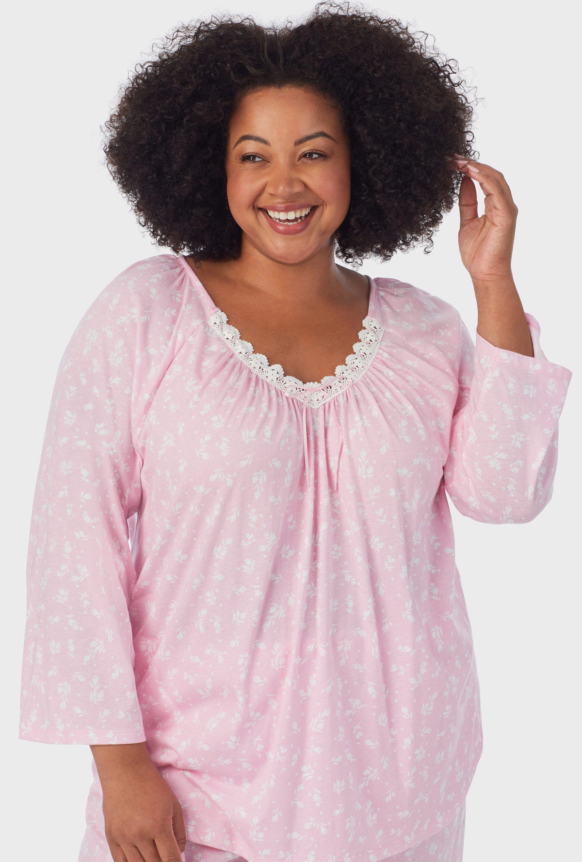 A lady wearing pink 3/4 Sleeve Long Pant plus size PJ Set with White Rosebuds  print