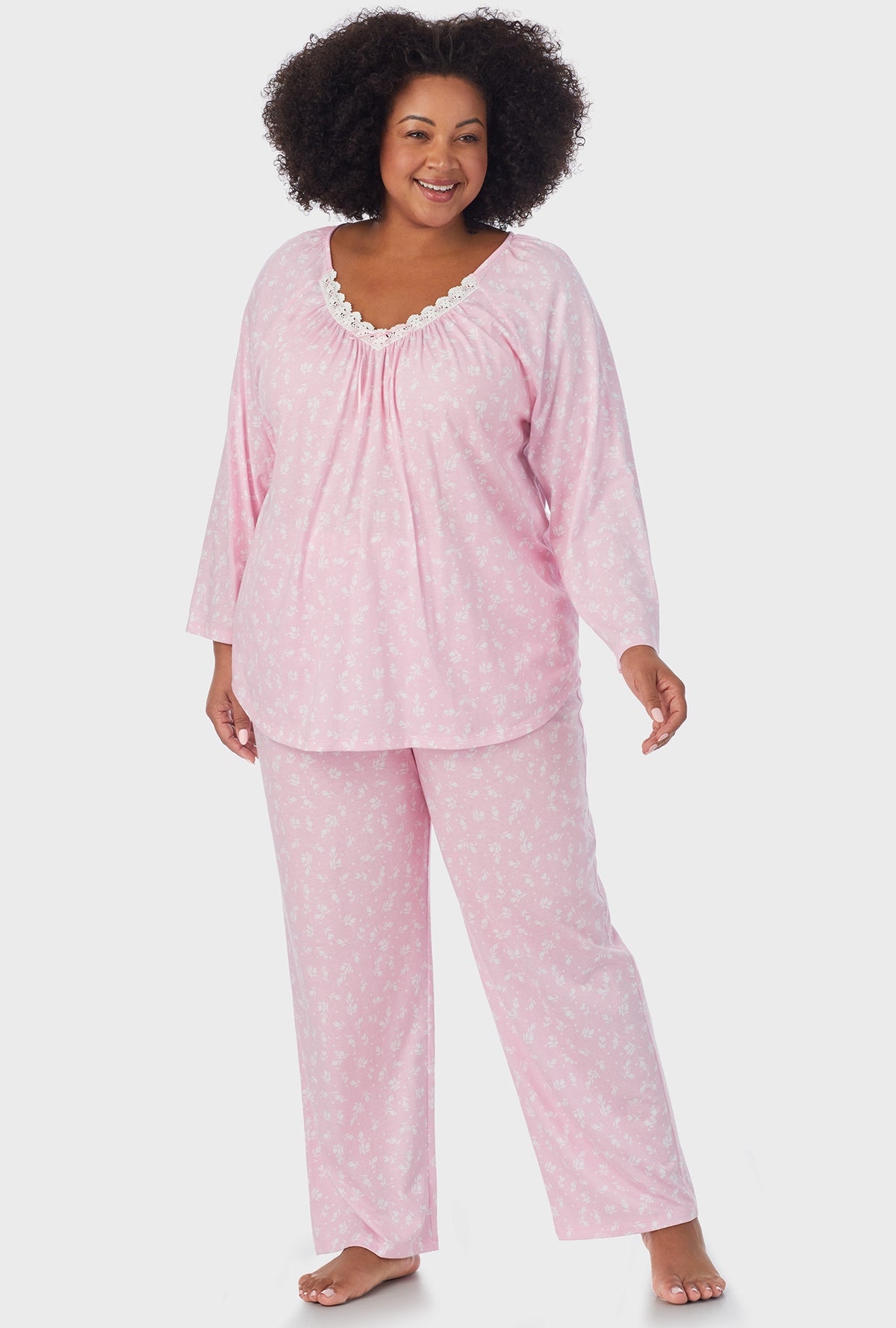 A lady wearing pink 3/4 Sleeve Long Pant plus size PJ Set with White Rosebuds print