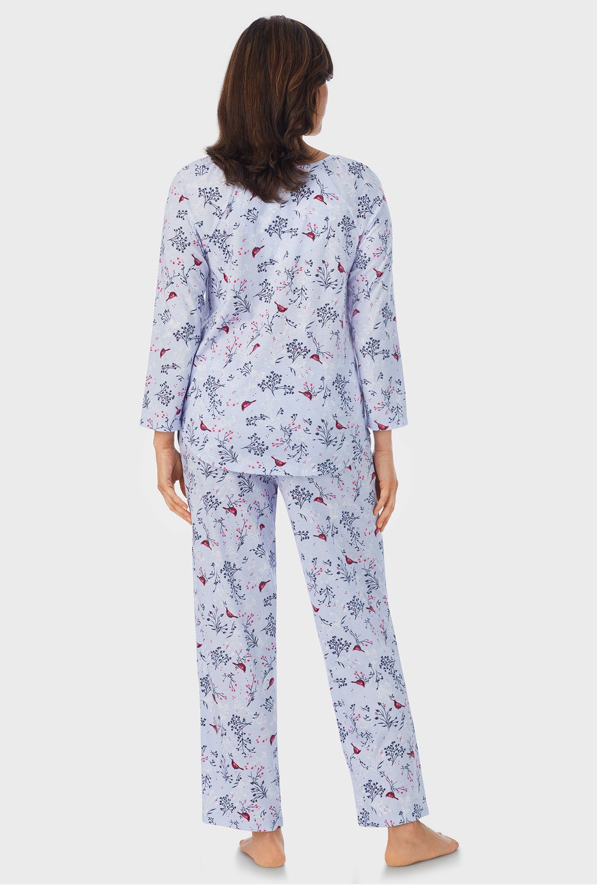 A lady wearing white 3/4 Sleeve Long Pant PJ Set with Winter Blue Cardinal  print
