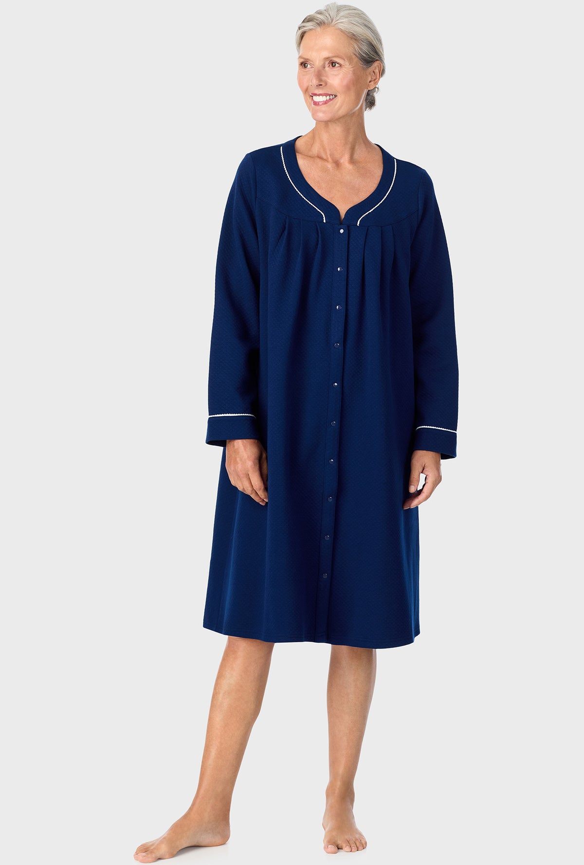 A lady wearing Navy Diamond Matalasse Snap Front Duster