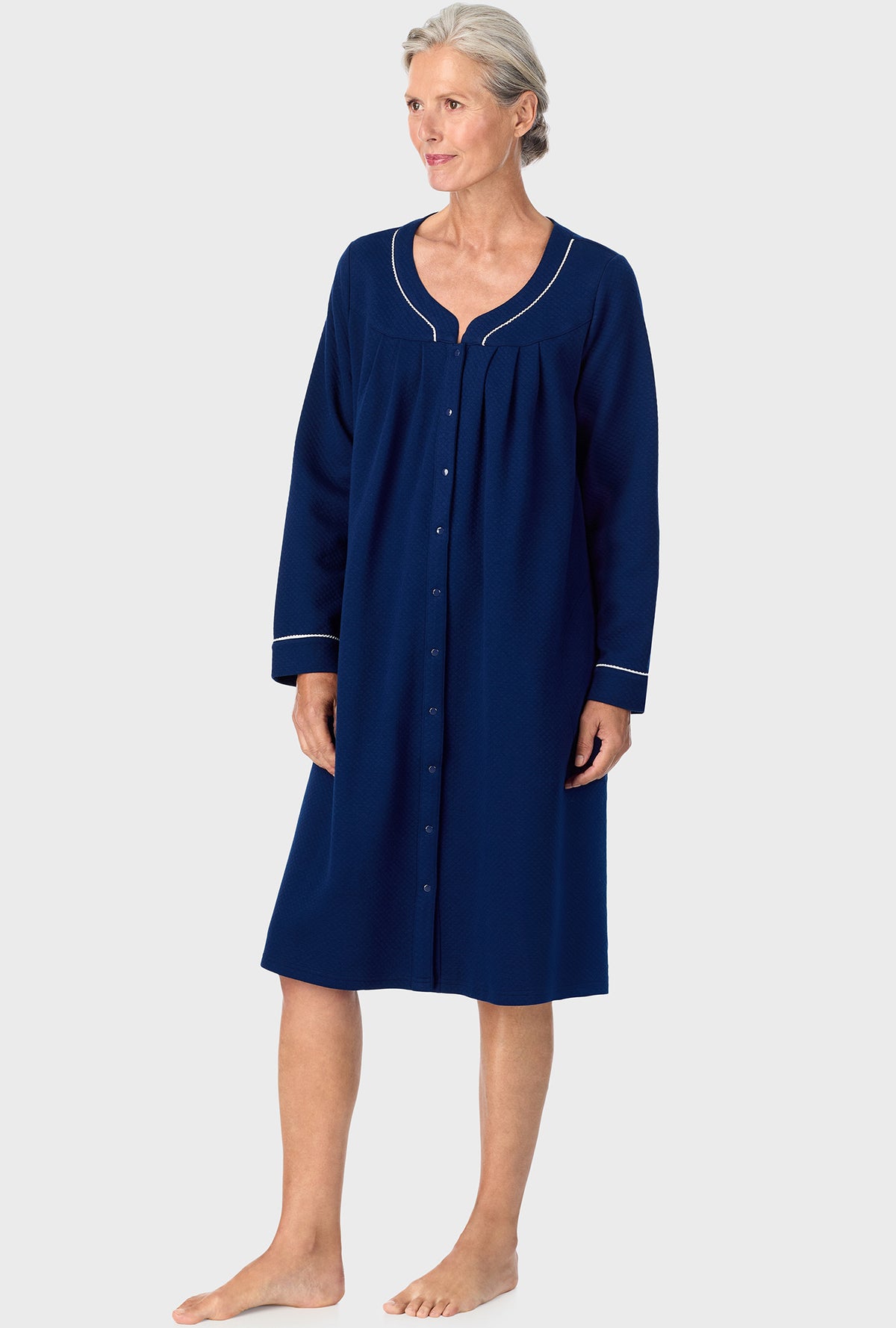 A lady wearing Navy Diamond Matalasse Snap Front Duster