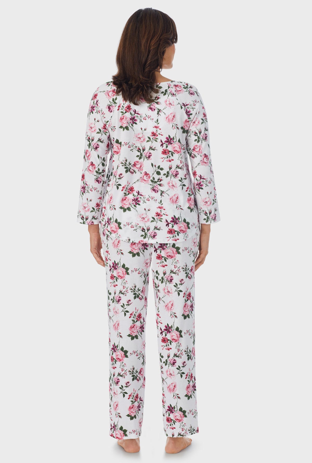 A lady wearing 3/4 Sleeve Long Pant PJ Set with Pink and Berry Roses   print