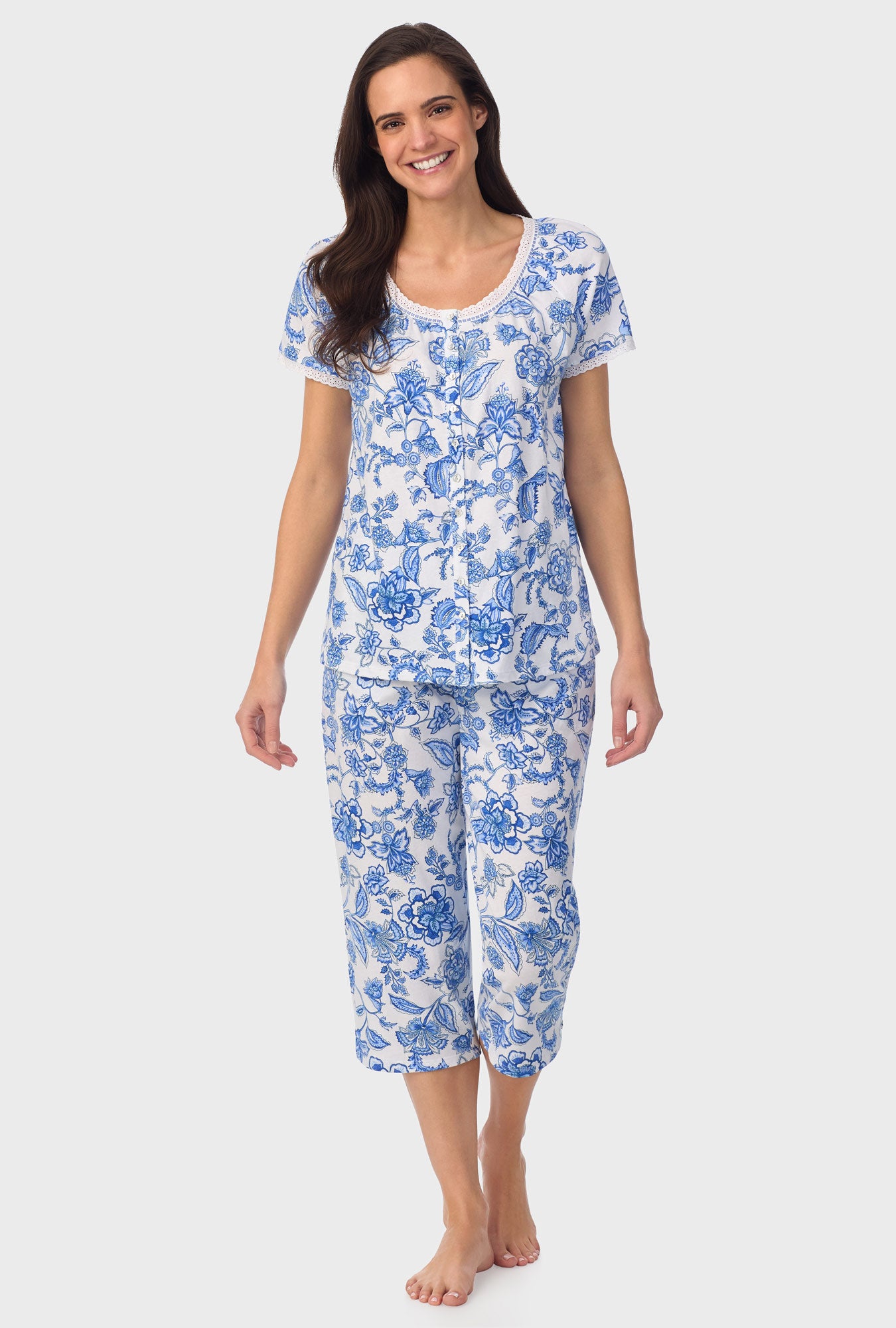 A lady wearing blue short Sleeve Floral Vine Cap Sleeve Capri Pant PJ Set with Colbalt Blue print
