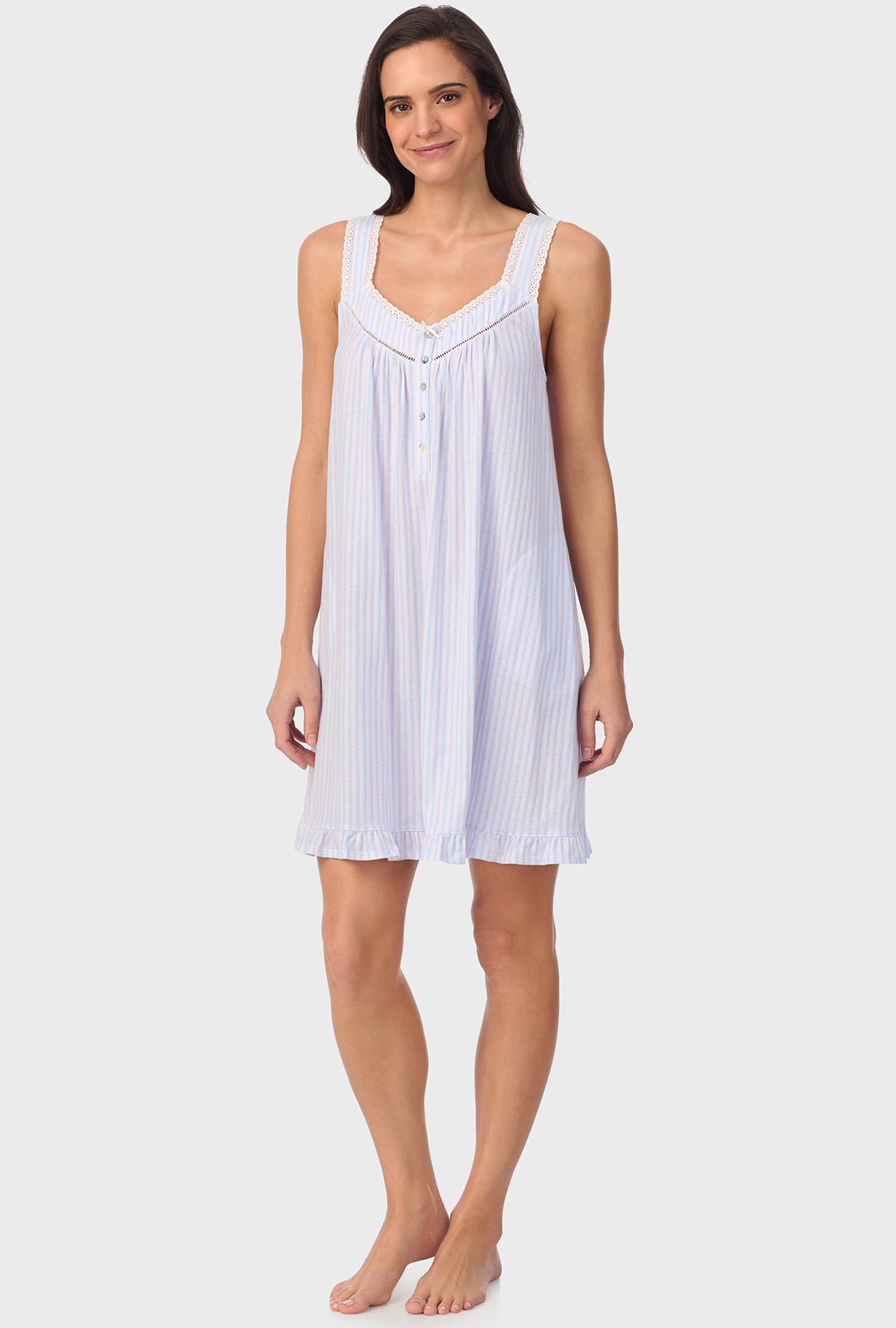 A lady wearing white sleeveless Blossom Stripes Sleeveless Chemise with Cotton Blue print
