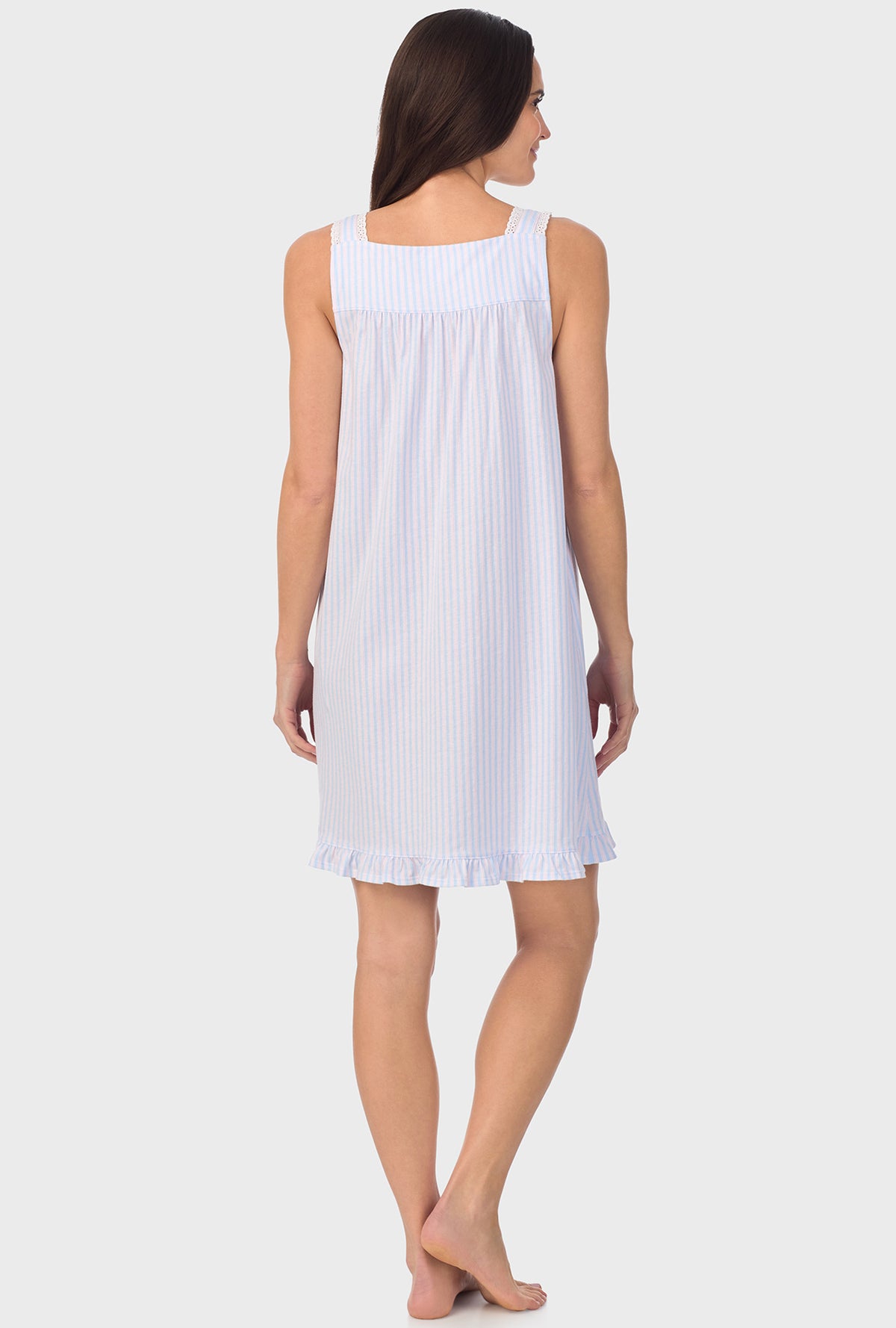 A lady wearing white sleeveless Blossom Stripes Sleeveless Chemise with Cotton Blue print