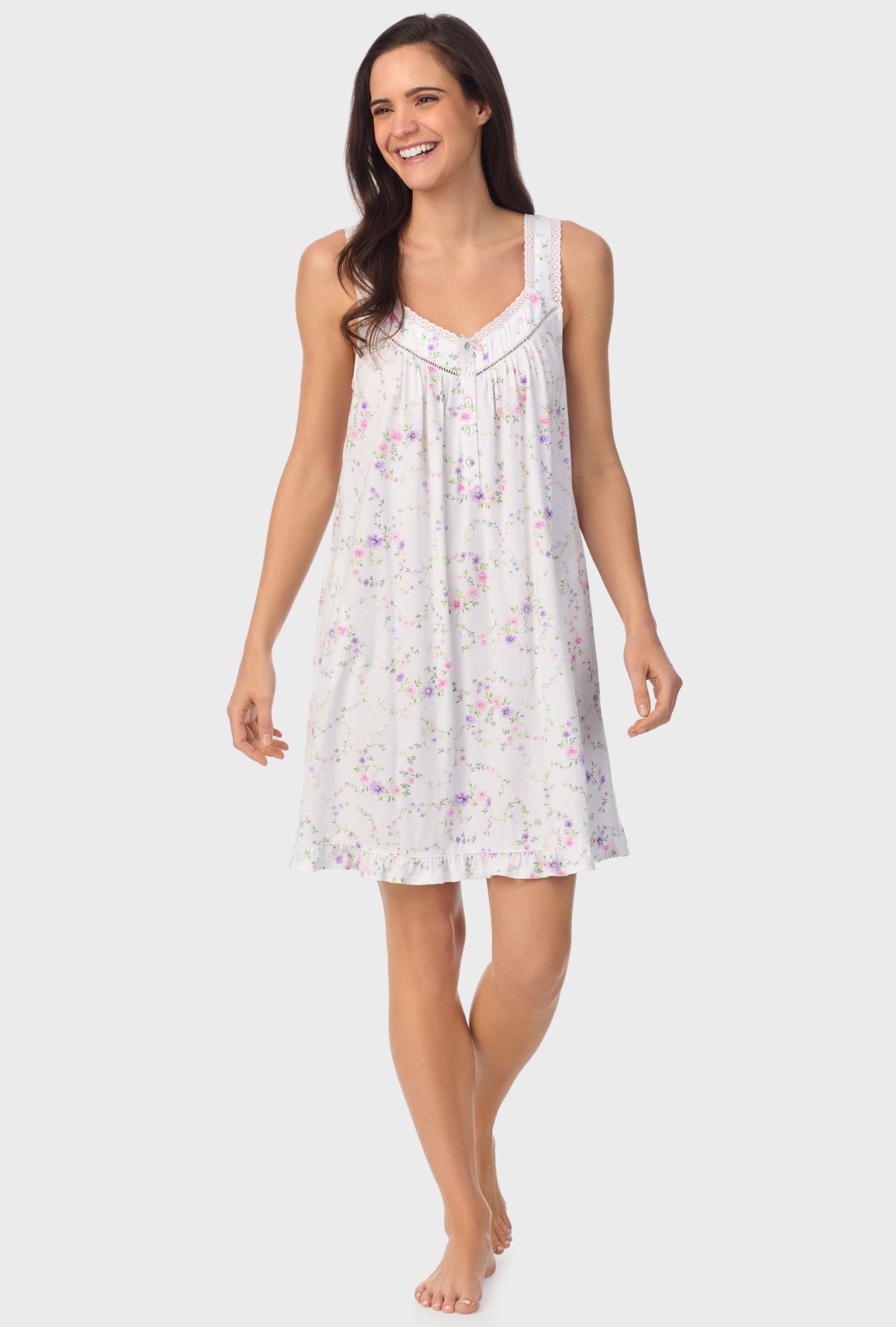 A lady wearing white sleeveless Viney Floral Sleeveless Chemise with Lilac and Cherry Blossom print