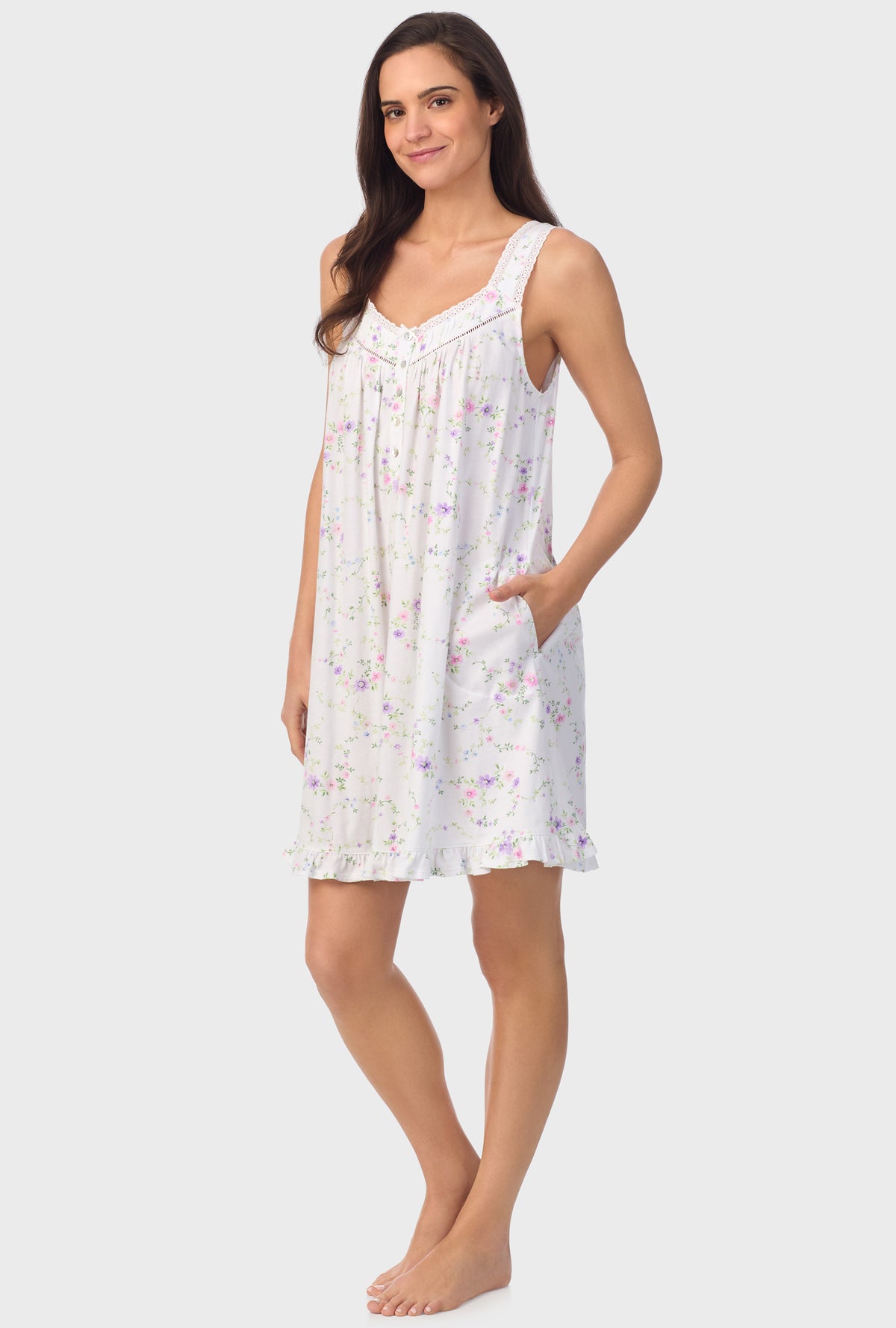 A lady wearing white sleeveless Viney Floral Sleeveless Chemise with Lilac and Cherry Blossom print