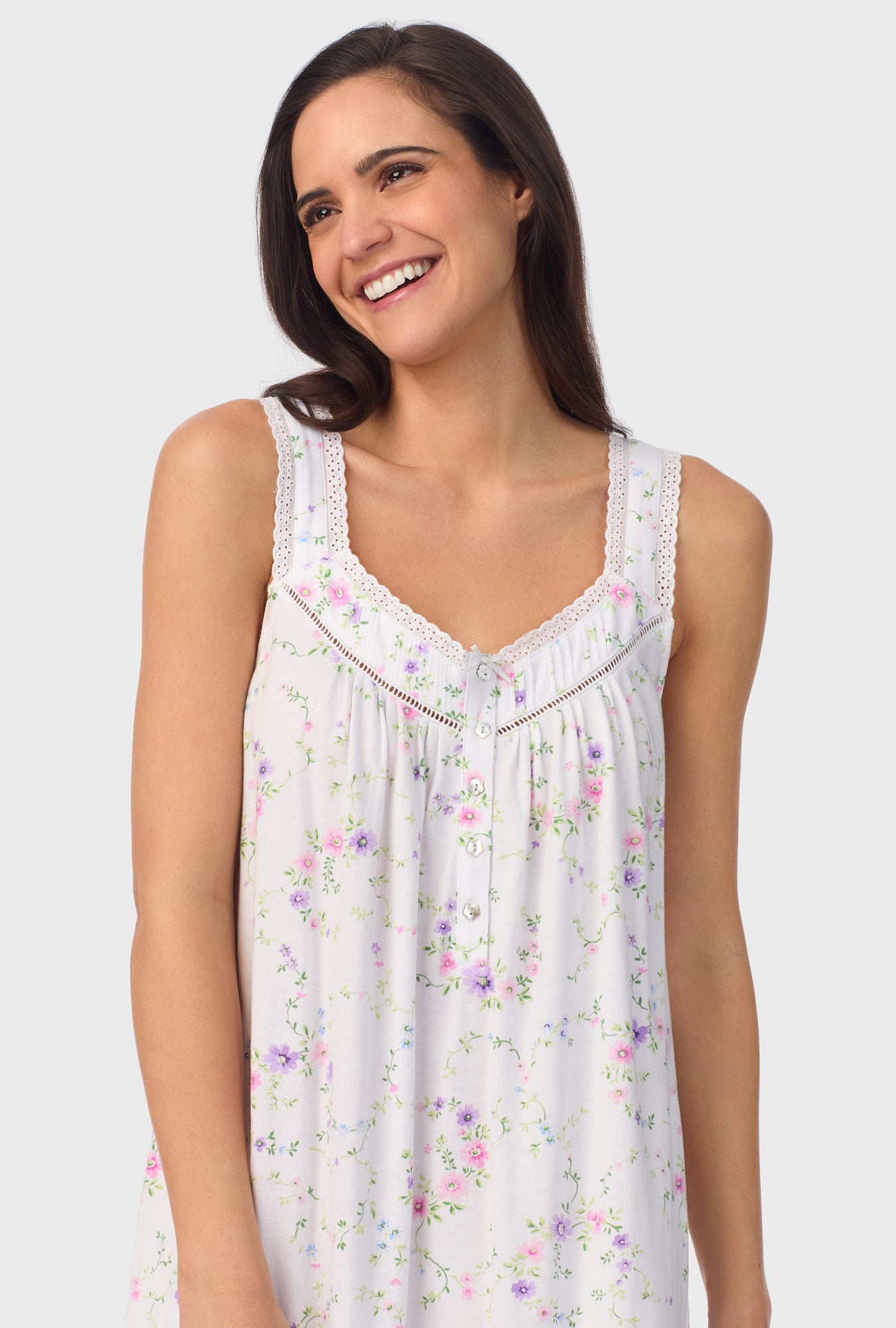 A lady wearing white sleeveless Viney Floral Sleeveless Chemise with Lilac and Cherry Blossom print