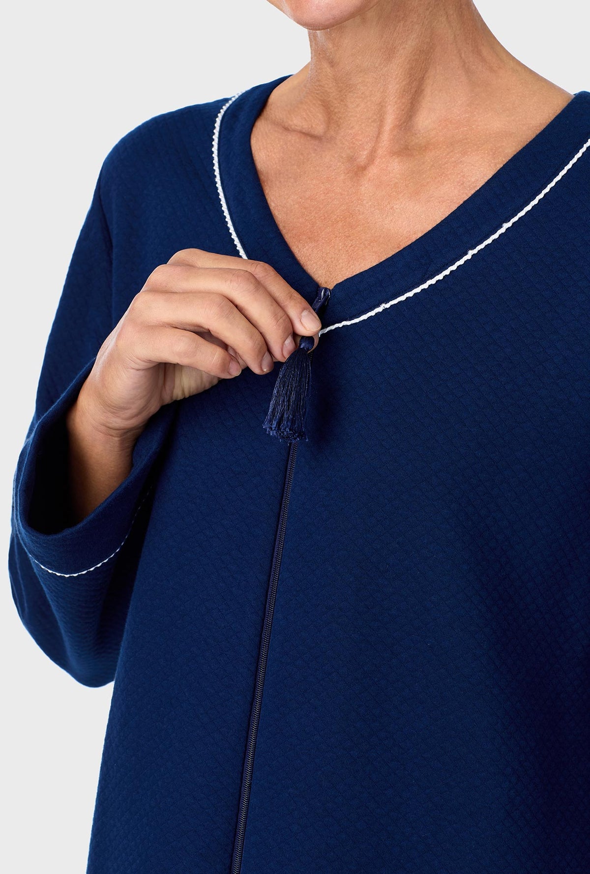 A lady wearing Navy Diamond Matalasse Zip Front Robe