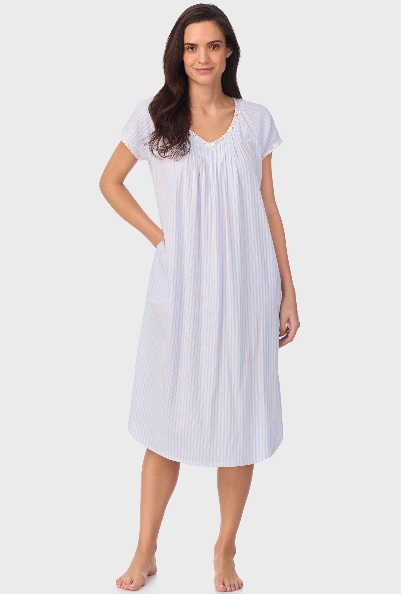 A lady wearing white short Sleeve Blossom Stripes Cap Sleeve Nightgown with Cotton Blue print