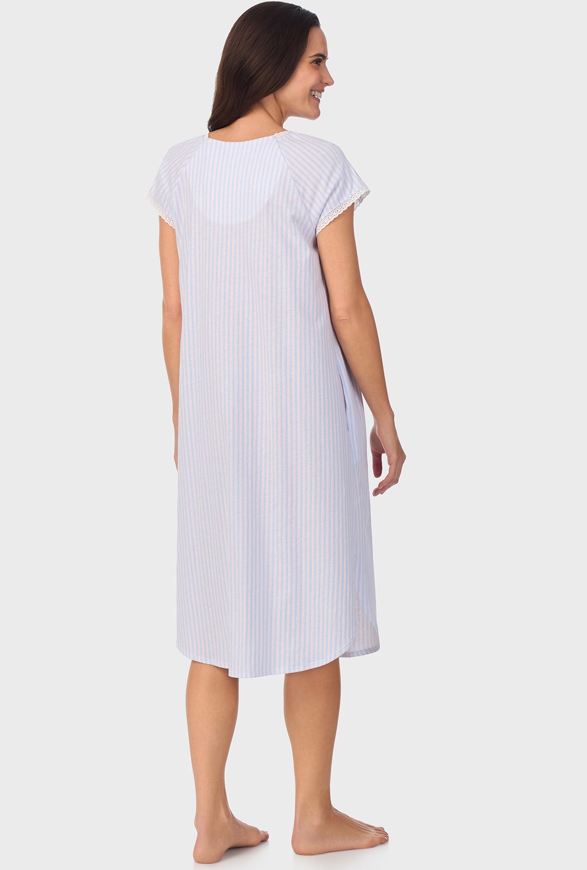 A lady wearing white short Sleeve Blossom Stripes Cap Sleeve Nightgown with Cotton Blue print