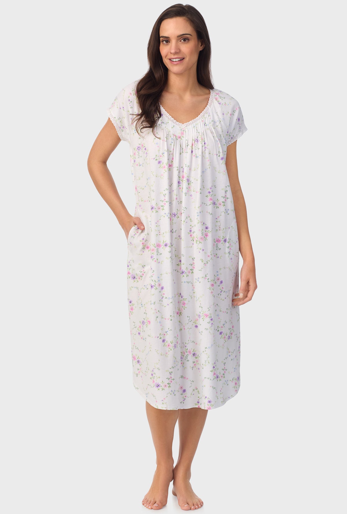 A lady wearing white short sleeve Viney Floral Cap Sleeve Nightgown with Lilac and Cherry Blossom print