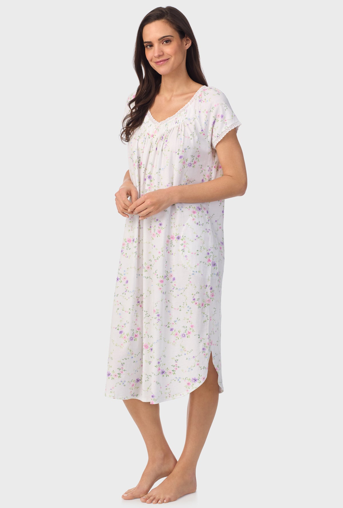 A lady wearing white short sleeve Viney Floral Cap Sleeve Nightgown with Lilac and Cherry Blossom print