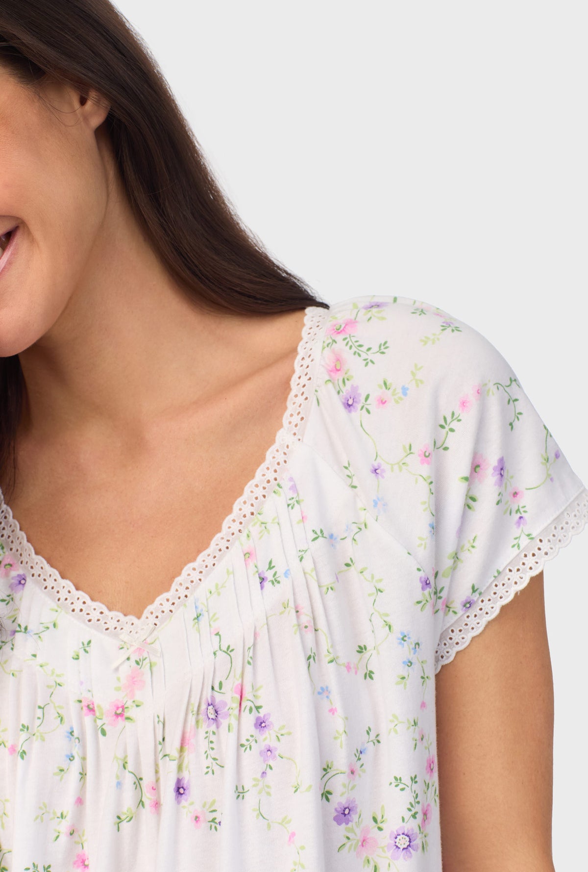 A lady wearing white short sleeve Viney Floral Cap Sleeve Nightgown with Lilac and Cherry Blossom print