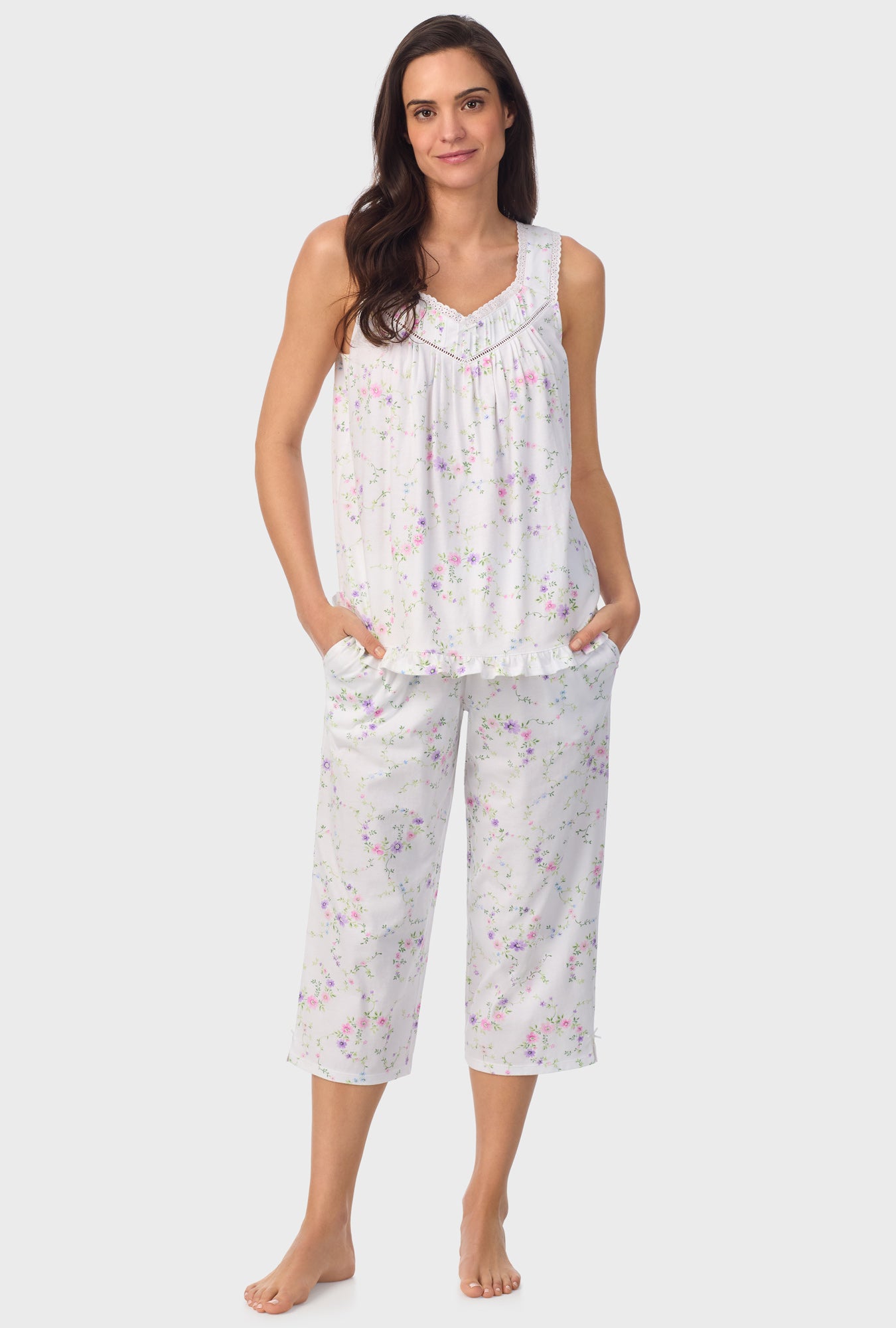 A lady wearing white sleeveless Viney Floral Sleeveless Capri Pant PJ Set with Lilac and Cherry Blossom print