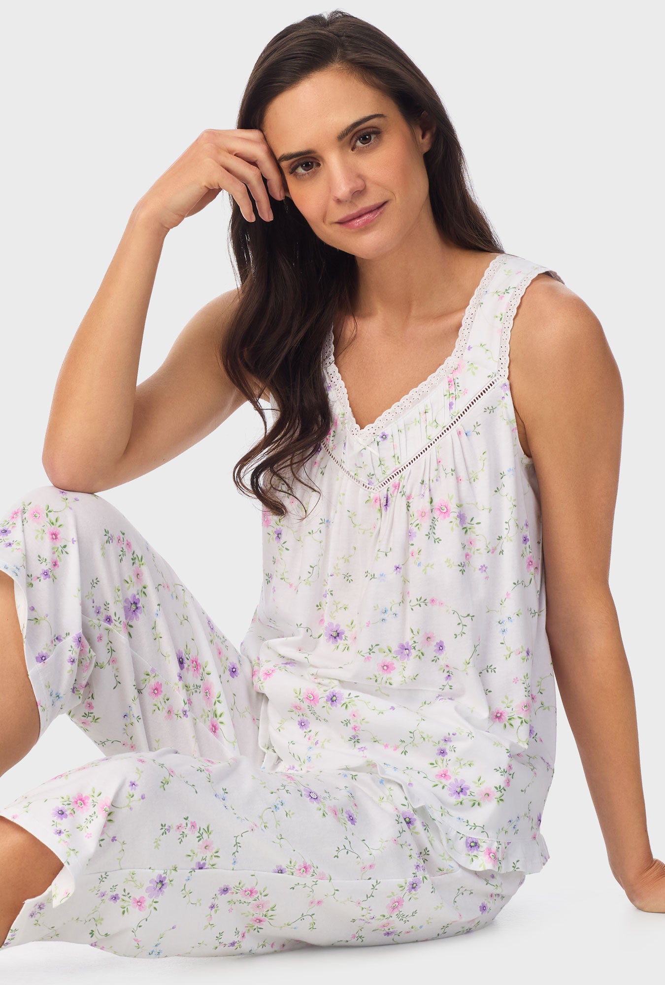 A lady wearing white sleeveless Viney Floral Sleeveless Capri Pant PJ Set with Lilac and Cherry Blossom print