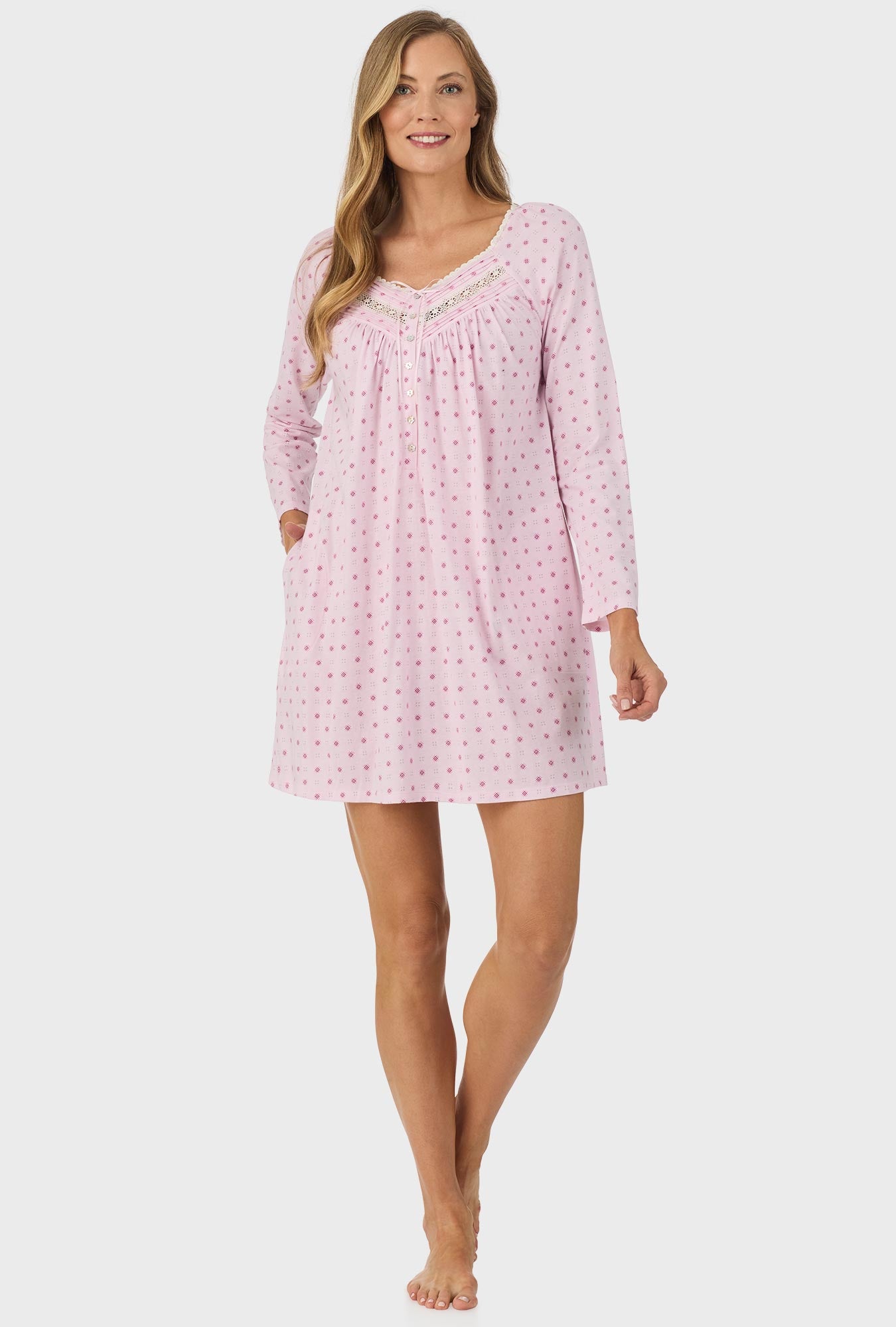 A lady wearing pink long sleeve cotton candy nightgown with pink geo print.