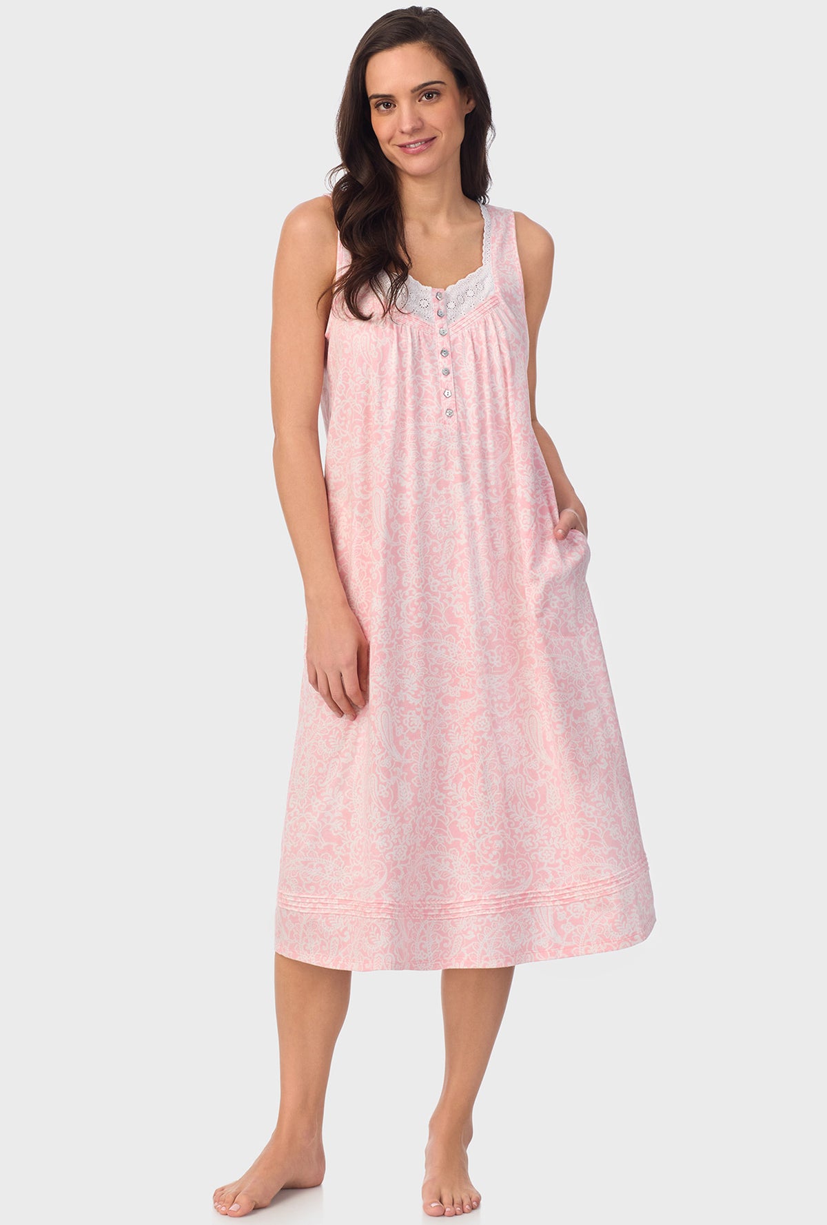 A lady wearing  pink sleeveless Nightgown with  Coral Pink Paisley print