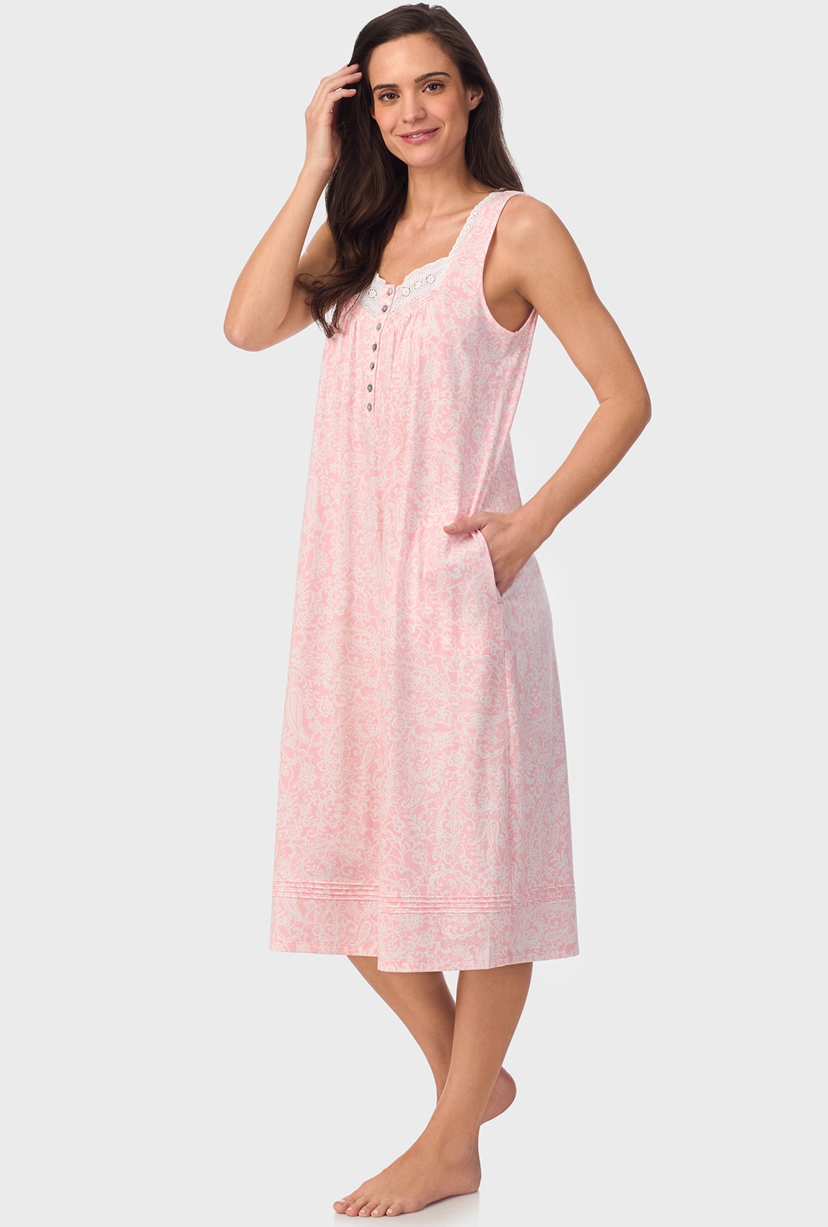 A lady wearing  pink sleeveless Nightgown with  Coral Pink Paisley print