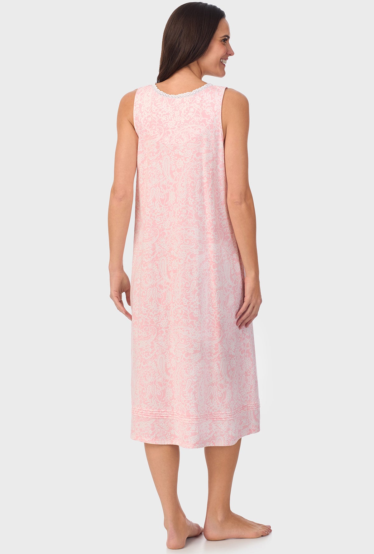 A lady wearing  pink sleeveless Nightgown with  Coral Pink Paisley print