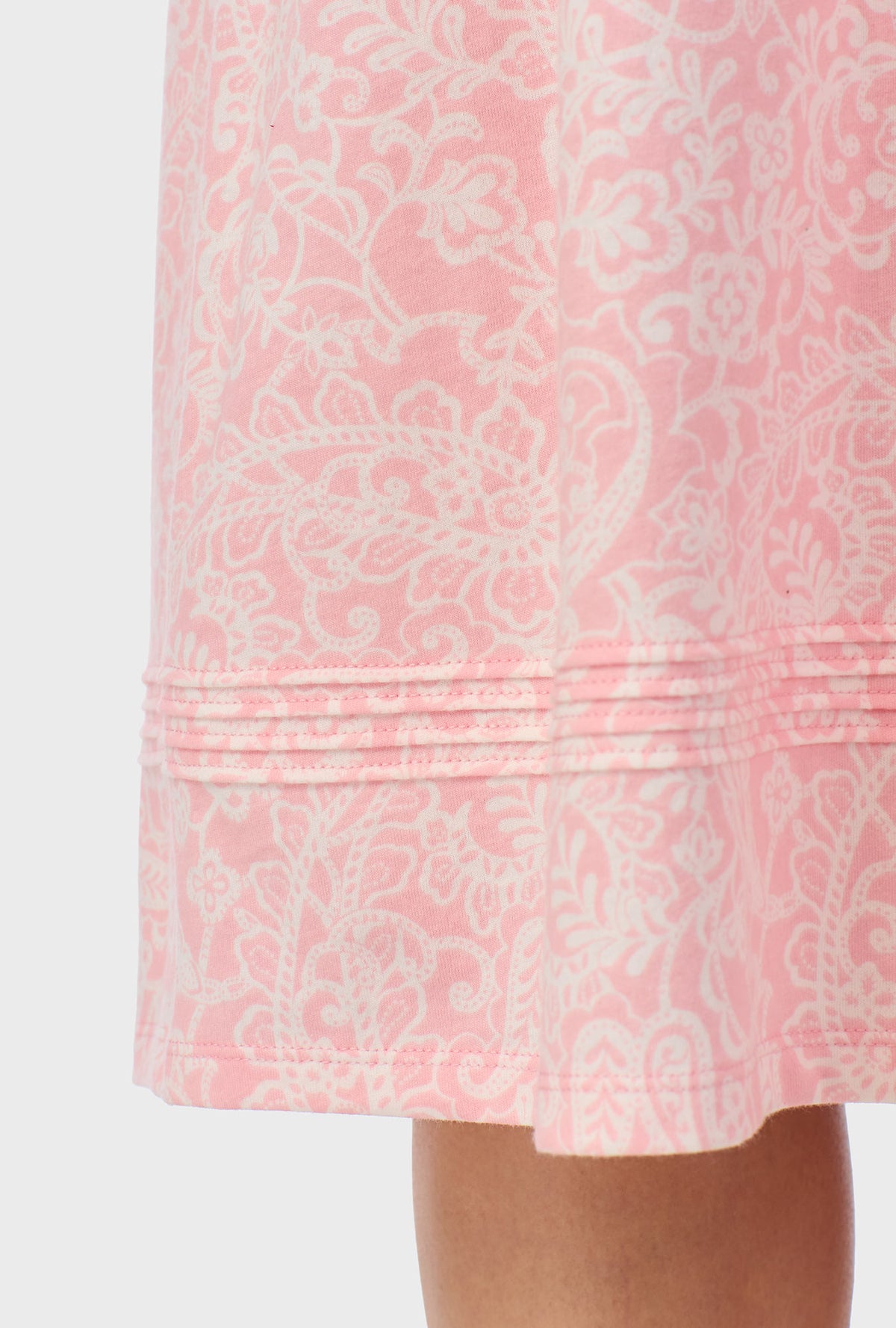 A lady wearing  pink sleeveless Nightgown with  Coral Pink Paisley print