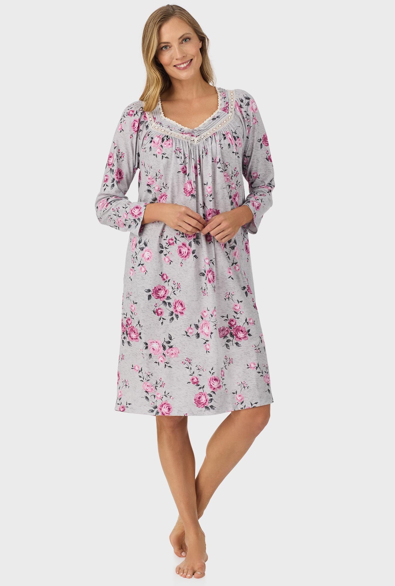 A lady wearing grey long sleeve nightgown with heather garden roses print.