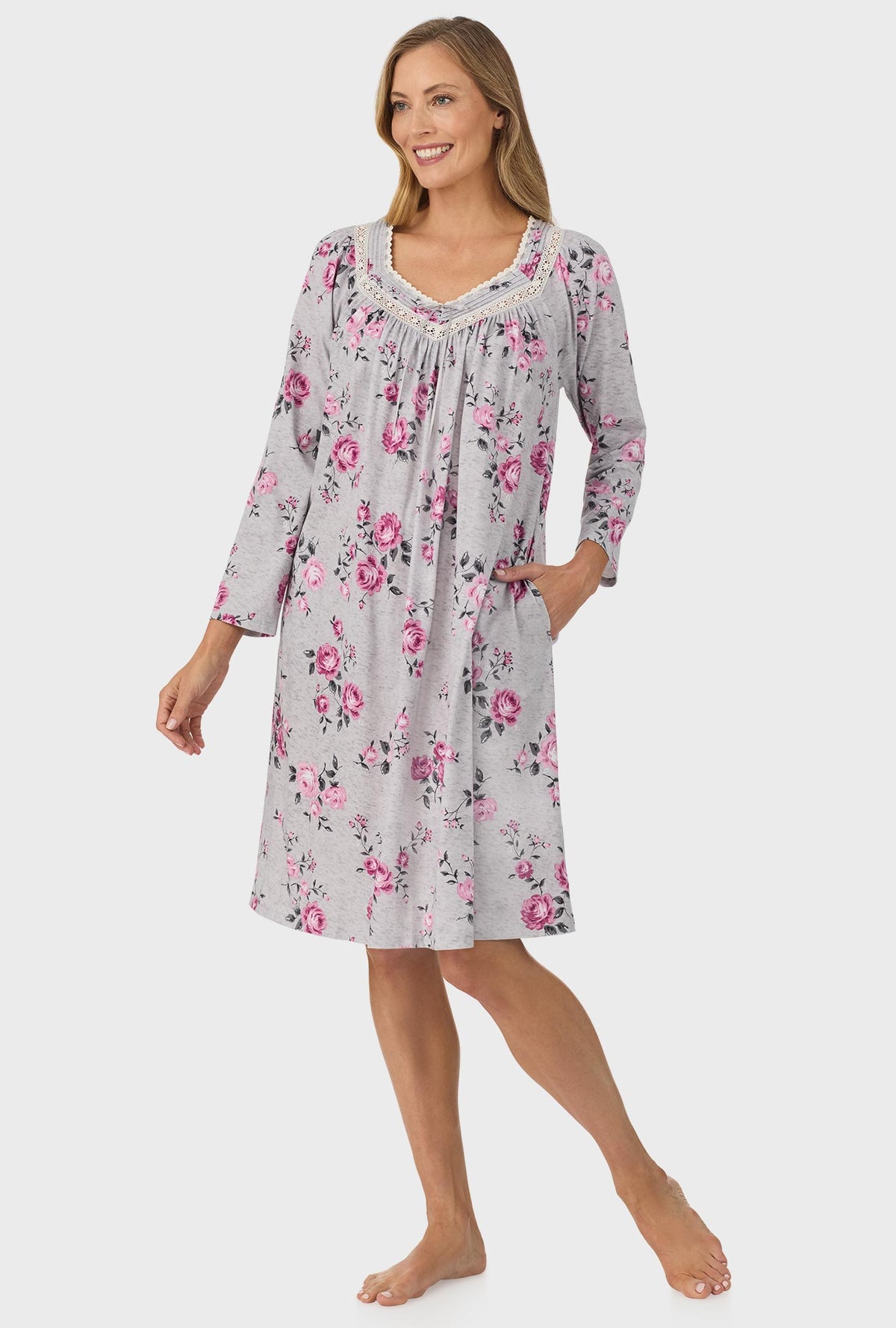 A lady wearing grey long sleeve nightgown with heather garden roses print.