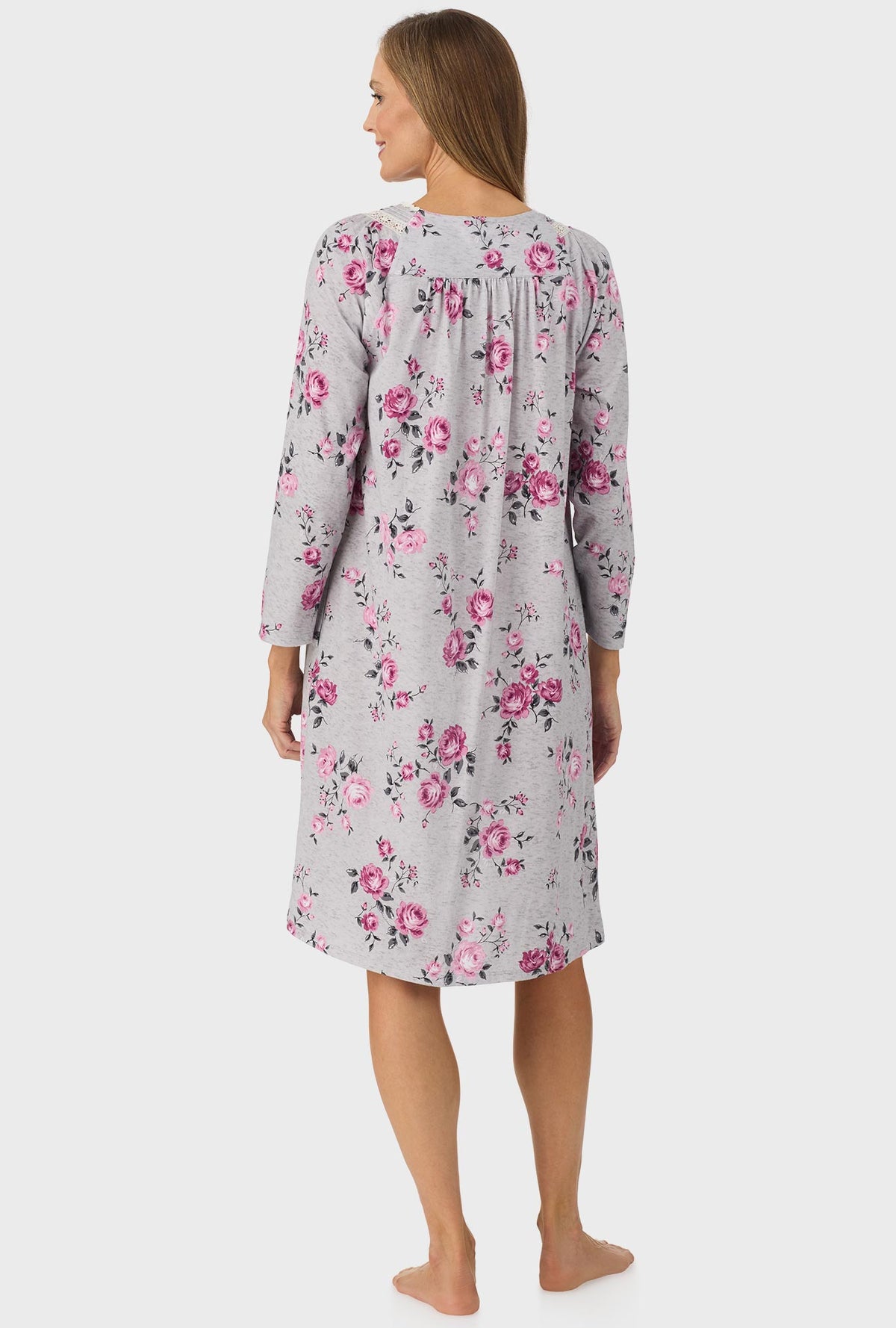 A lady wearing grey long sleeve nightgown with heather garden roses print.