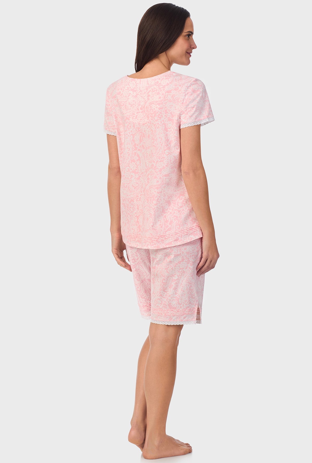 A lady wearing short sleeve Cap Sleeve Bermuda Pant PJ Set with  Coral Pink Paisley print